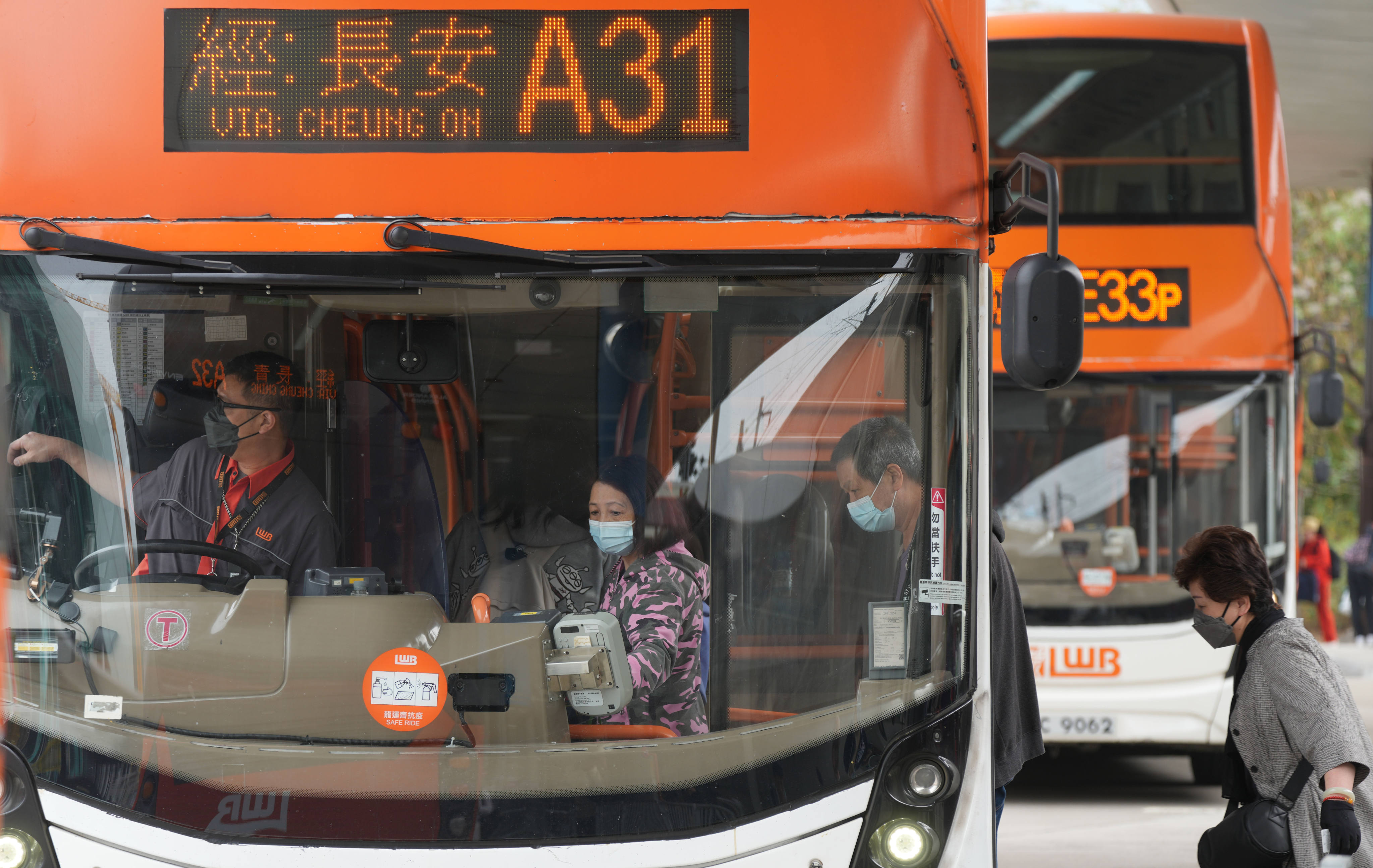 Travellers board a bus at Hong Kong International Airport on March 14. The previous administration’s decision to lower the qualifying age for senior concessionary fares to 60, from 65, has compounded the problem. Photo: Sam Tsang