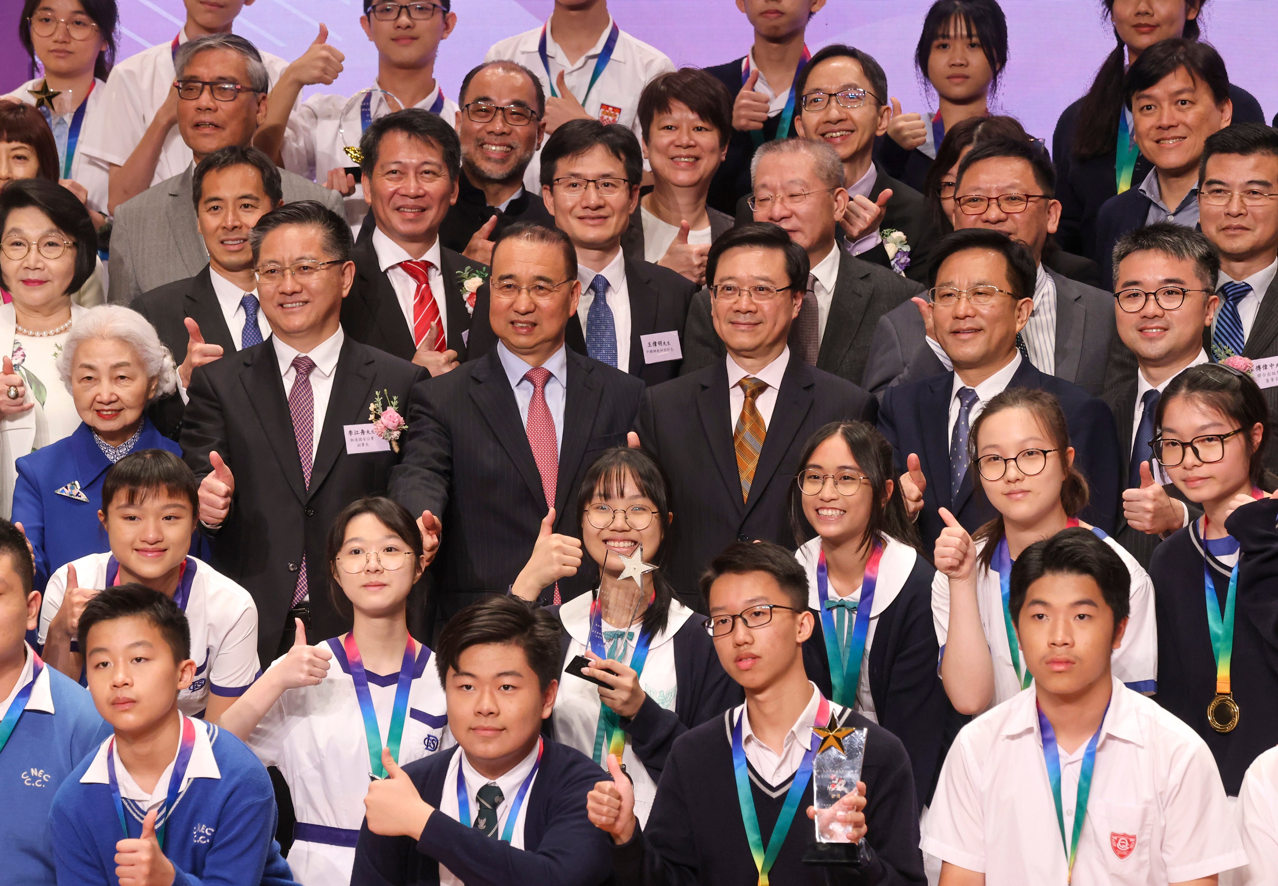 Liu Guangyuan, commissioner of the foreign ministry’s arm in the city (centre left), and Chief Executive John Lee (centre right), at the diplomacy knowledge quiz competition on Saturday. Photo: Jonathan Wong