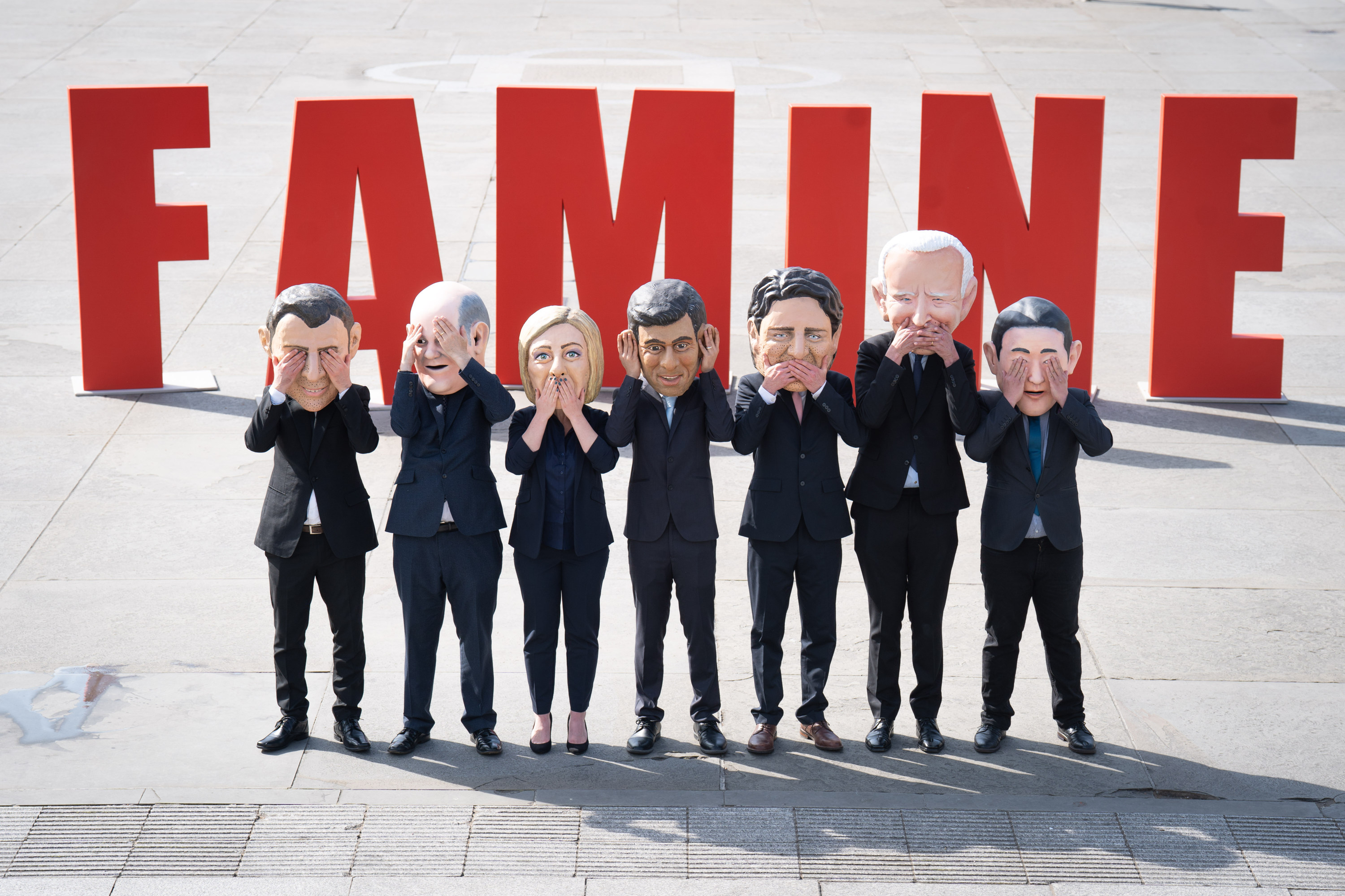 Oxfam activists wearing masks of G7 leaders to highlight their lack of action to tackle the East Africa hunger crisis. Photo: dpa