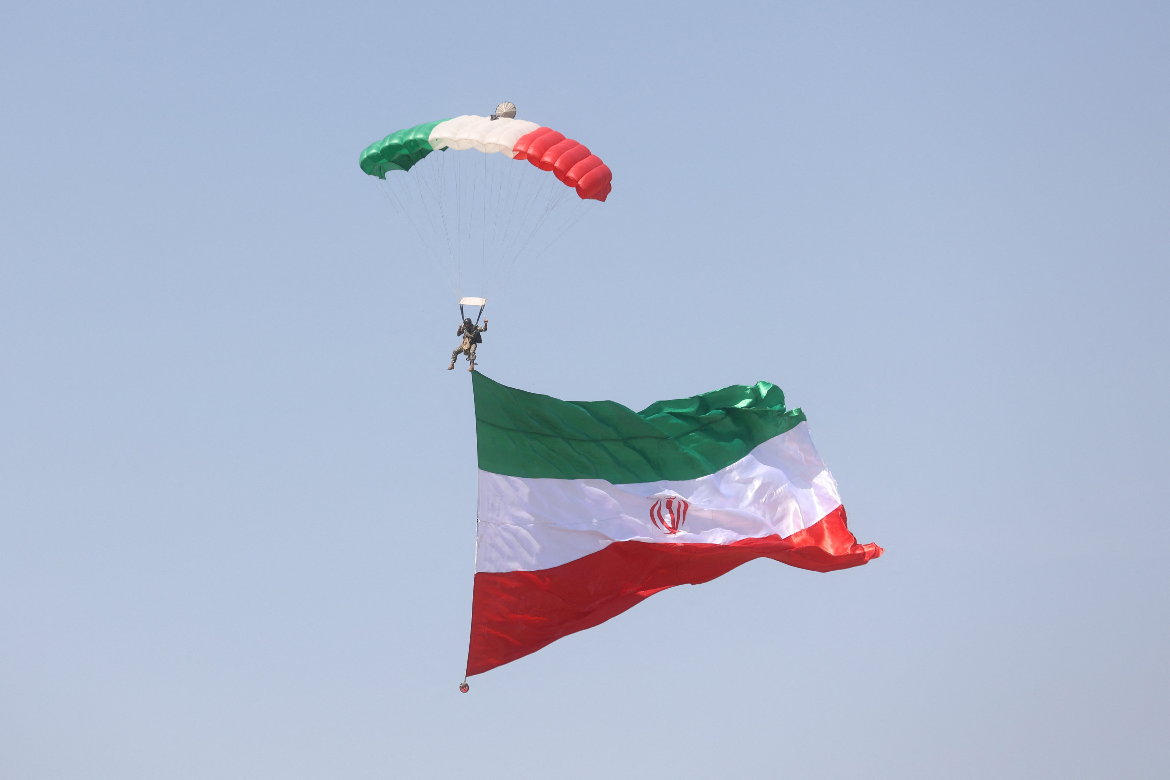 An Iranian paratrooper and Iranian flag in Tehran, Iran last month. On Saturday Iran’s judiciary said it had executed the head of a network that trafficked Iranian women to neighbouring countries for prostitution. Photo: WANA (West Asia News Agency) via Reuters.