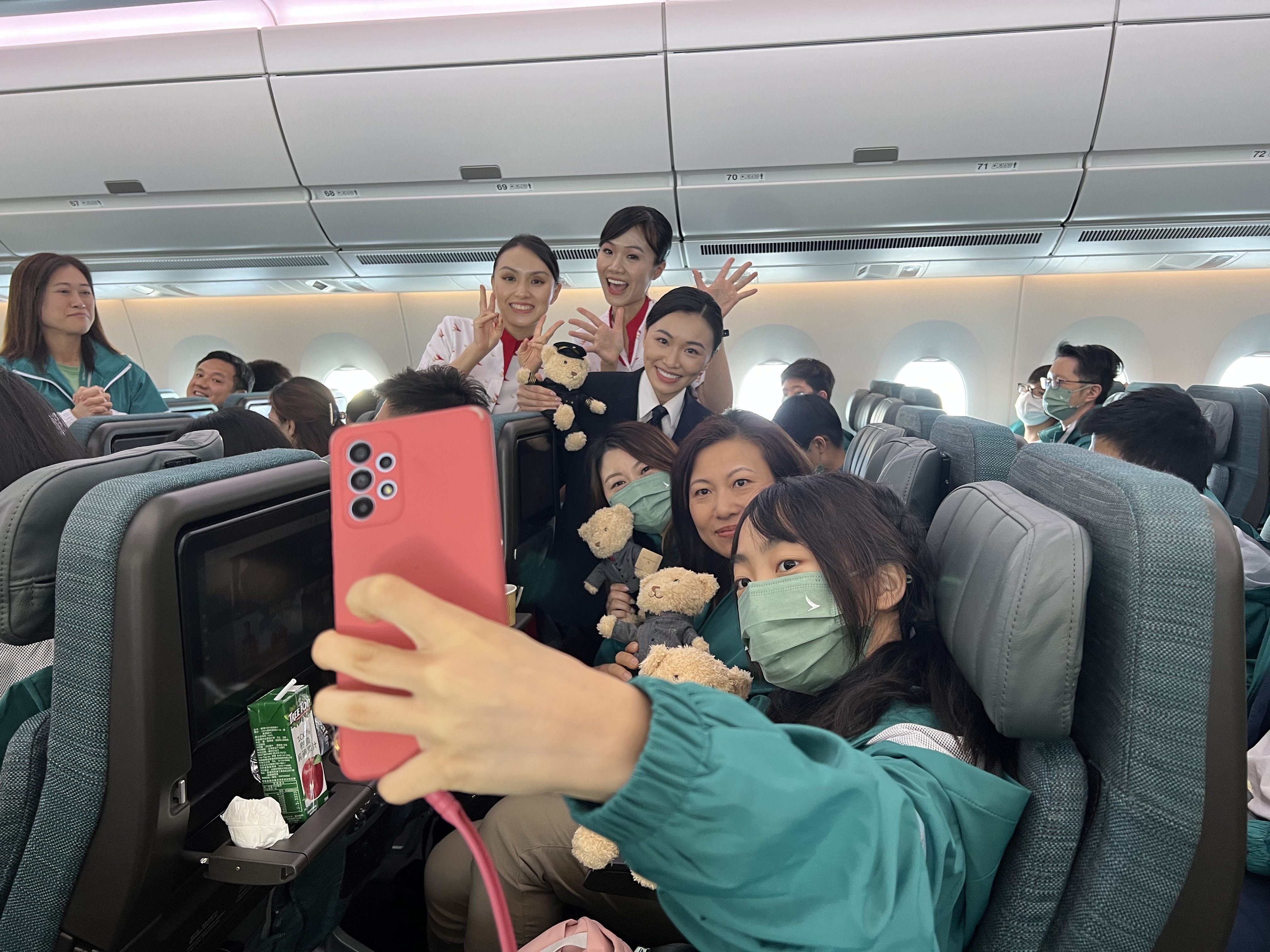 Jenny Lau poses for a photograph aboard the free Cathay flight on Sunday. Photo: Willa Wu