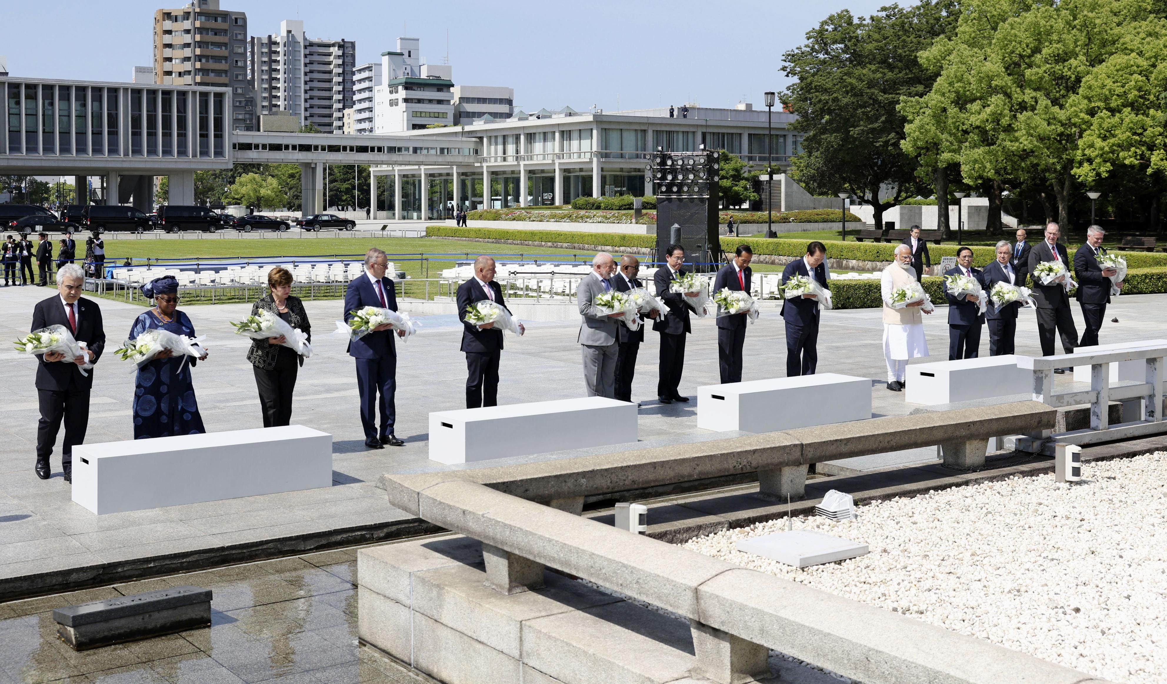 Leaders at the G7 summit in Hiroshima offer flowers at the cenotaph for atomic bomb victims at the Peace Memorial Park in the western Japanese city. Photo: Kyodo