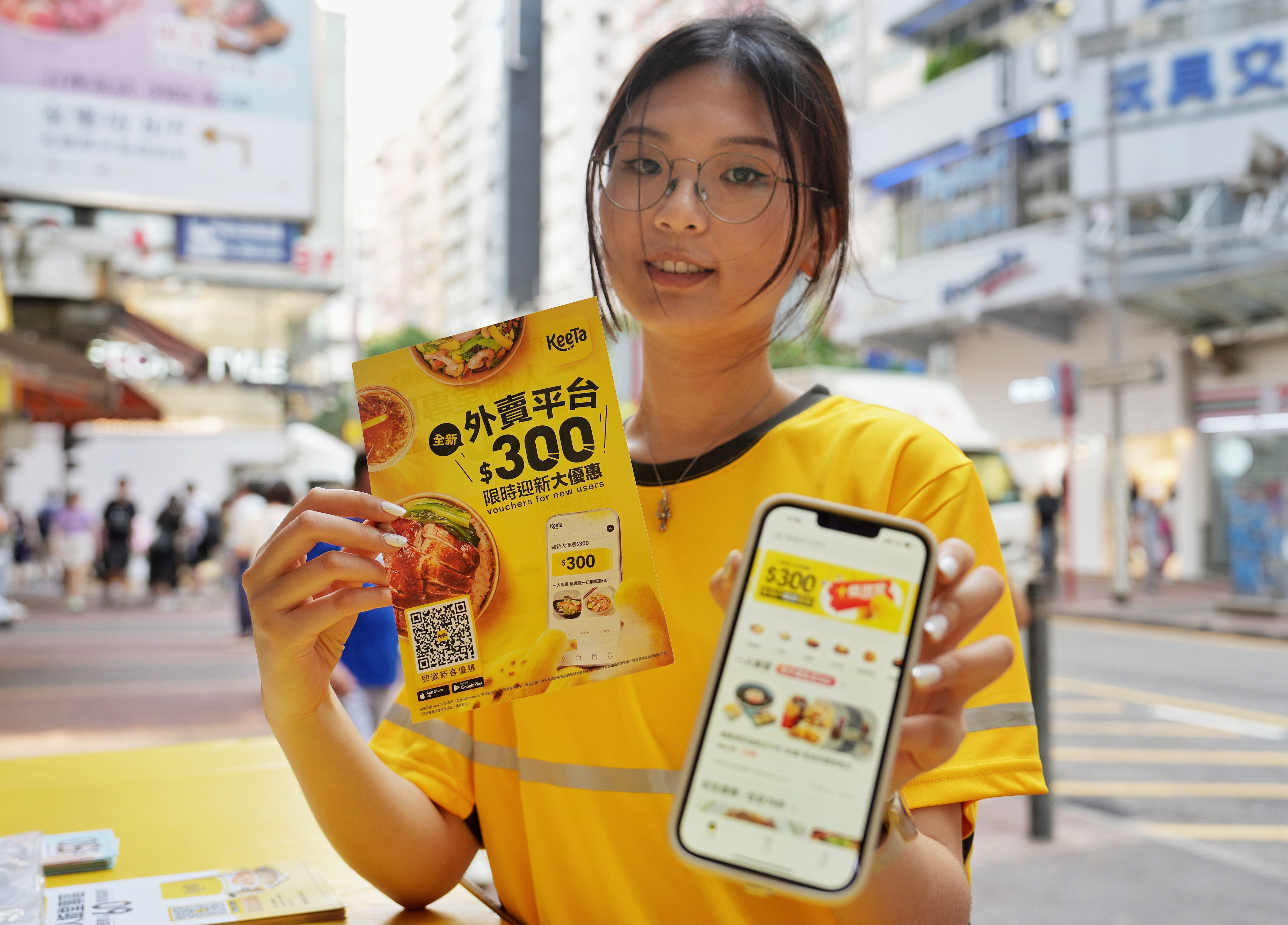 KeeTa staff hit the streets in Mong Kok to promote the new food delivery service. Photo: Elson Li