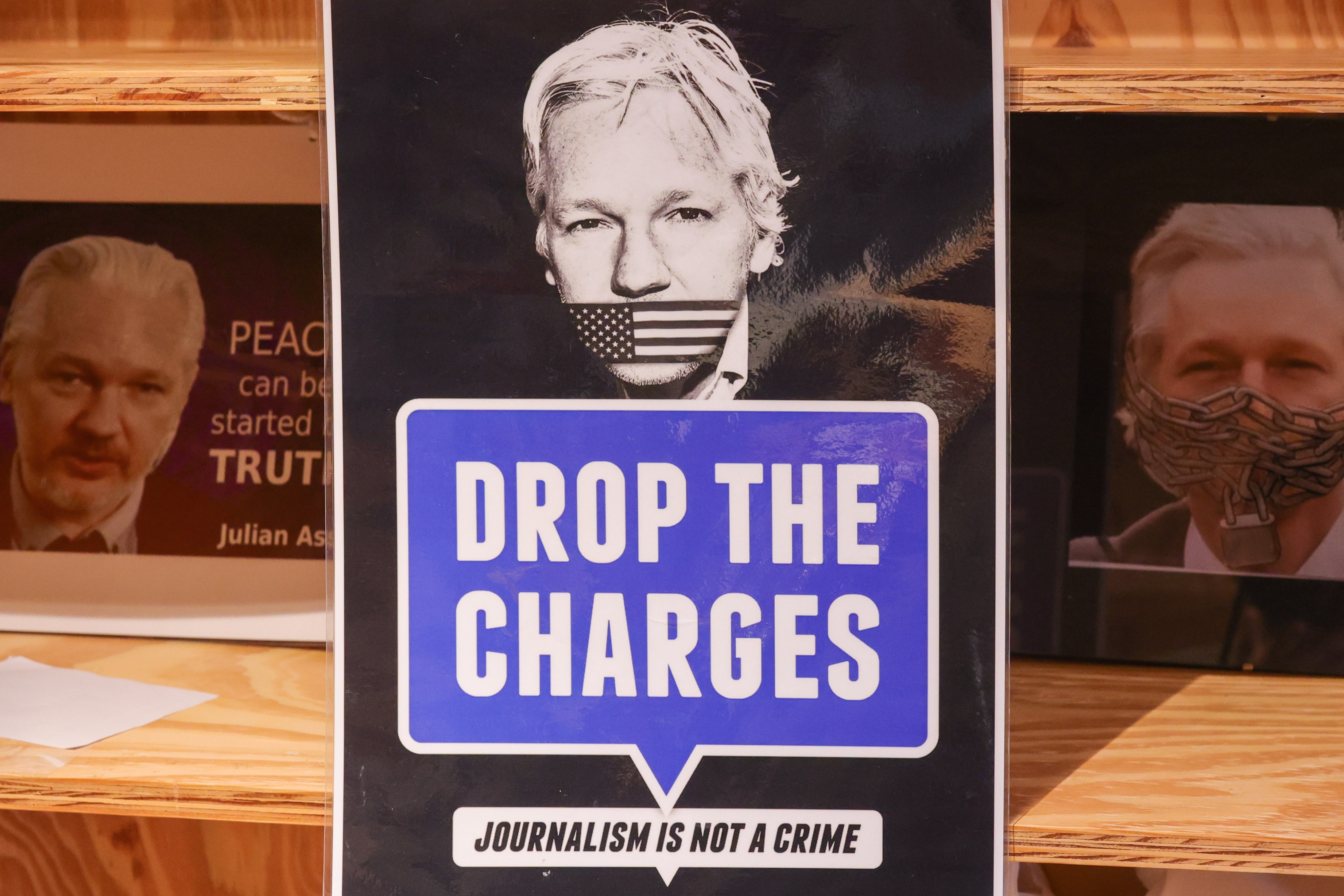 Signs are displayed at a protest to mark the fourth anniversary of WikiLeaks founder Julian Assange’s detention in London’s Belmarsh prison, in Brussels, Belgium, on April 11. Photo: EPA-EFE