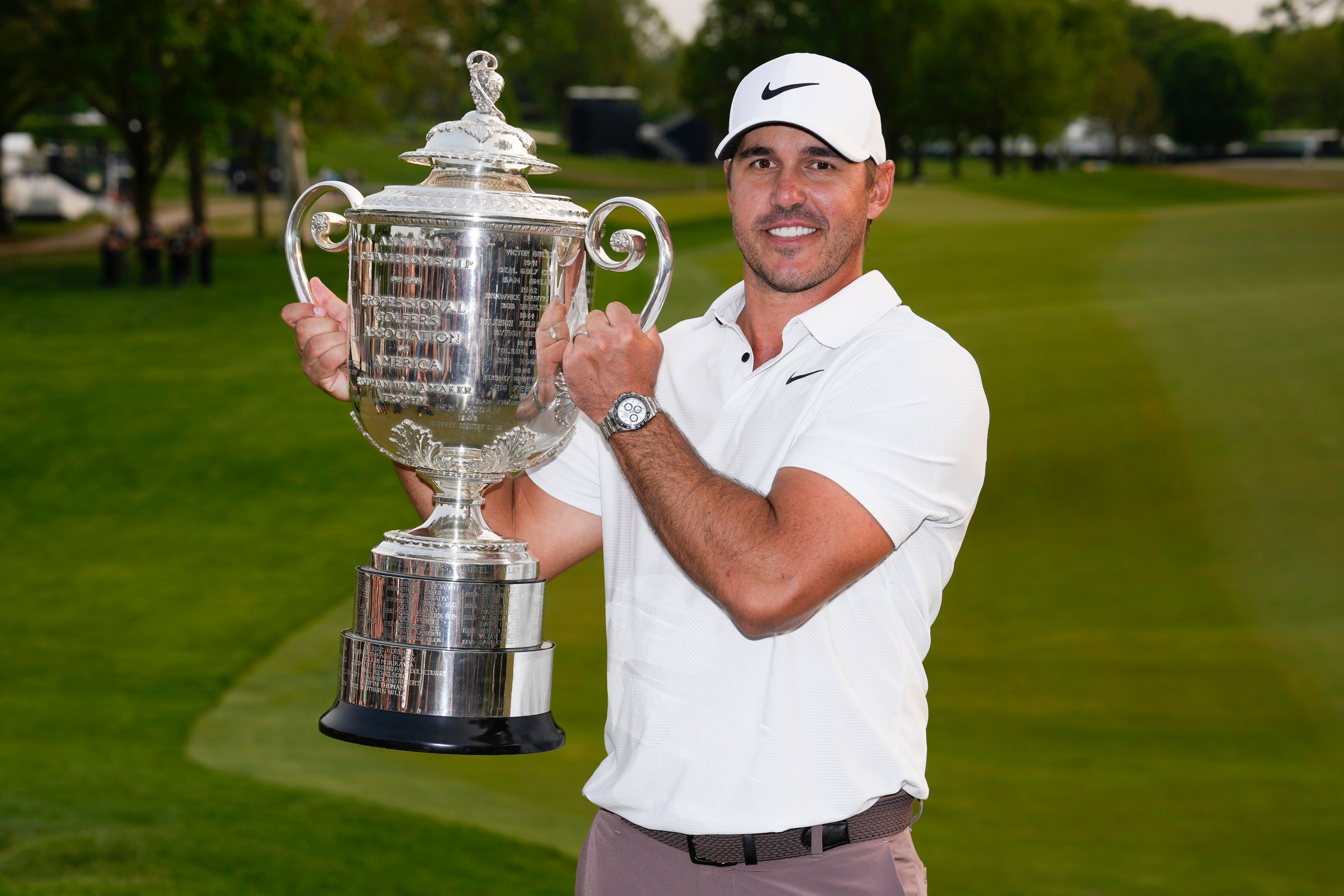 Brooks Koepka holds the Wanamaker trophy after winning the US PGA Championship. Photo: AP