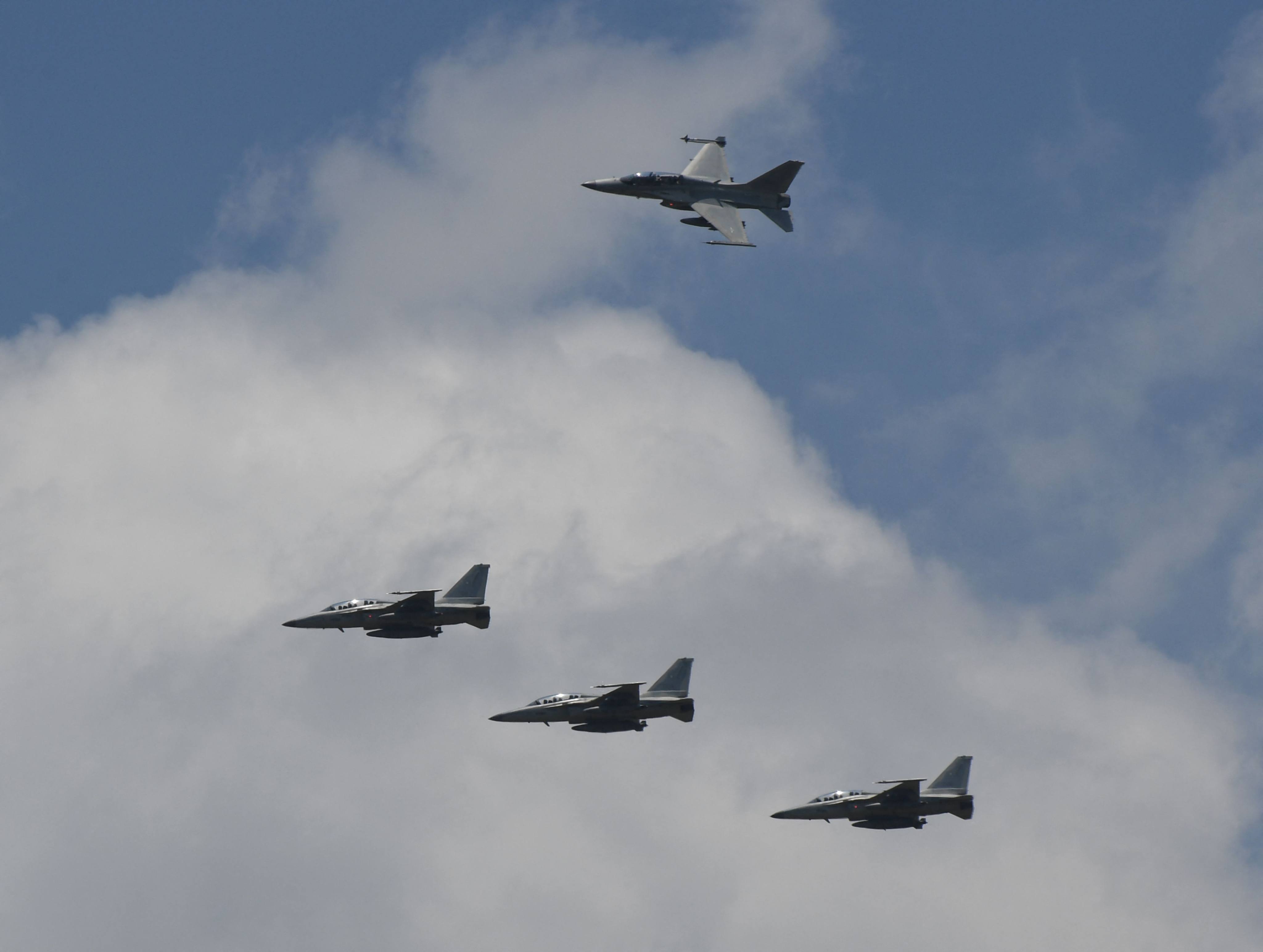 US F16 fighter jets fly in formation. File photo: AFP