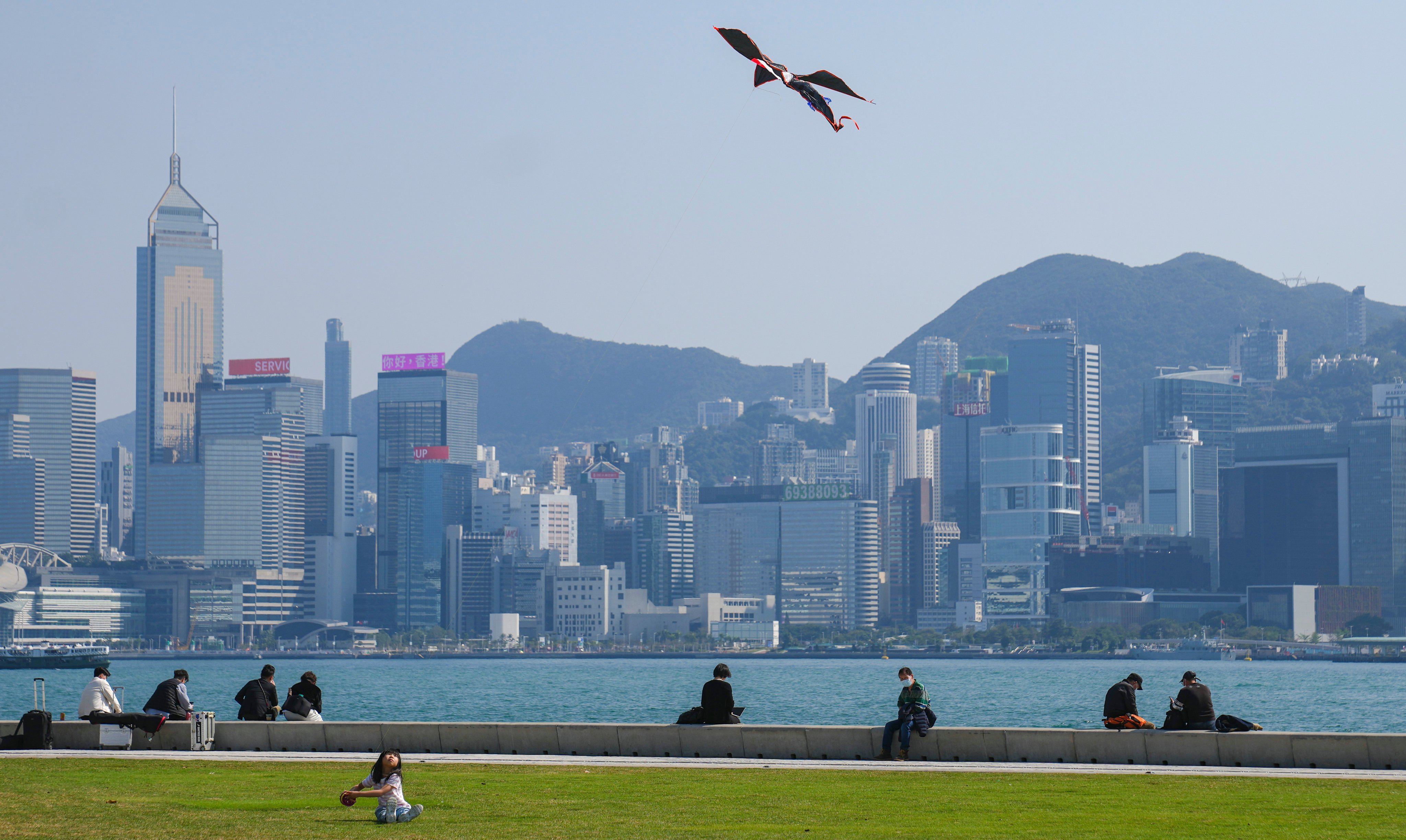 A girl flying a kite at the waterfront of West Kowloon Cultural District on 15 February 2023. Photo: Sam Tsang.