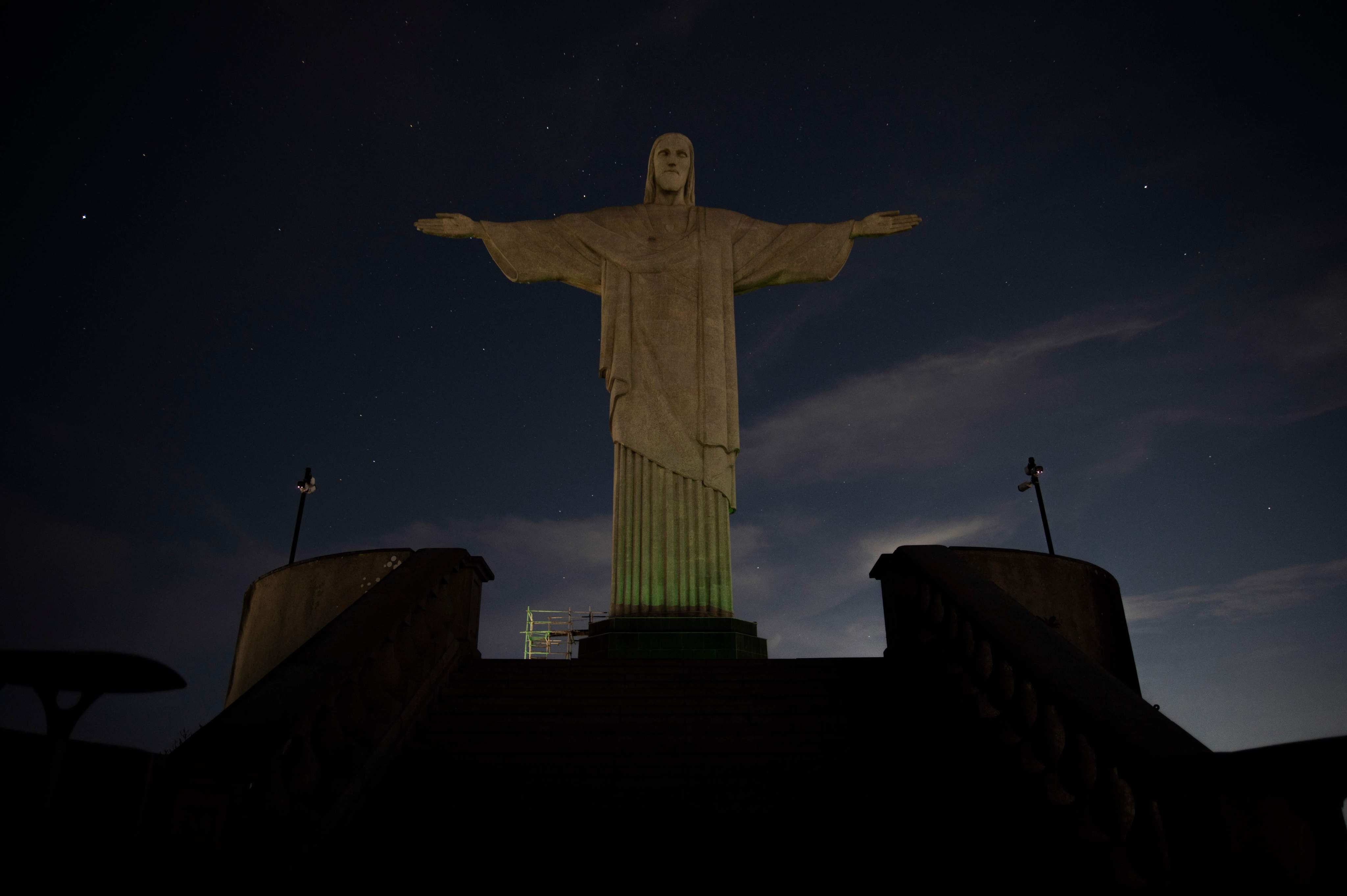 The Christ the Redeemer statue is seen without illumination to condemn racist acts against Brazilian footballer Vinicius Junior. Photo: AFP