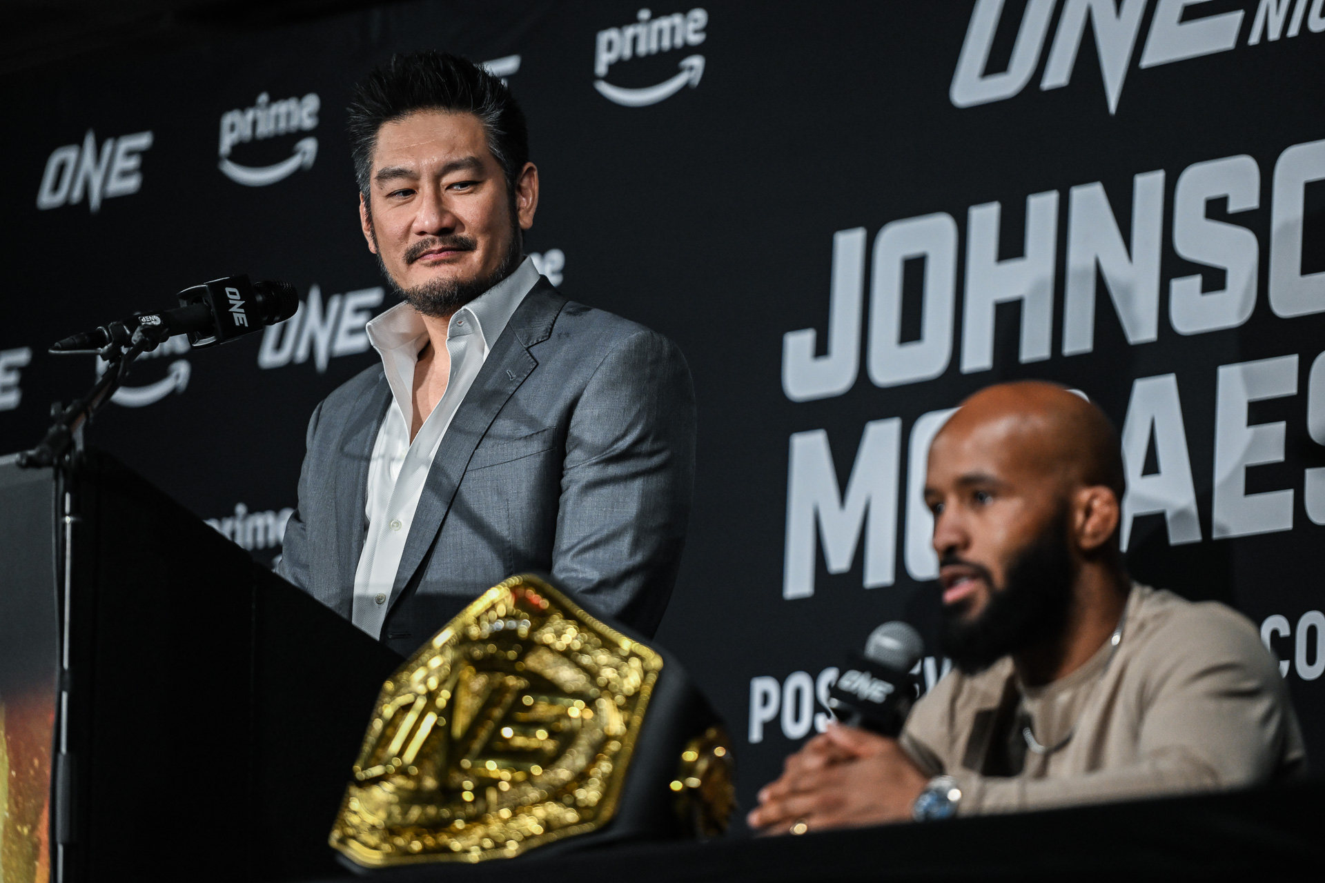 ONE chairman Chatri Sityodtong listens to Demetrious Johnson on stage at the Fight Night 10 post event press conference in Denver. Photos: ONE Championship 