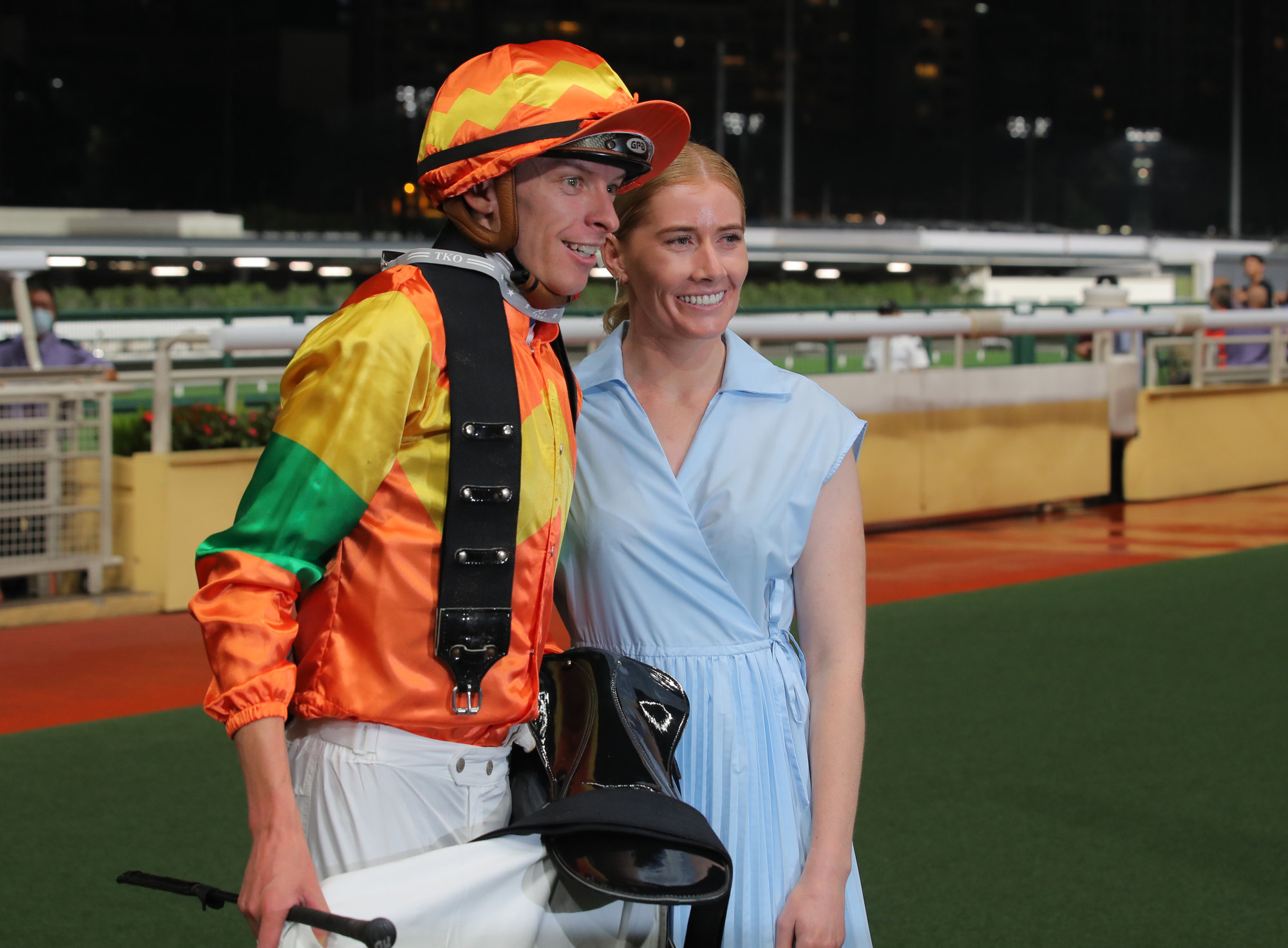 Michael Dee savours his Happy Valley victory on Starry Night with his partner, former jockey Mikaela Lawrence.