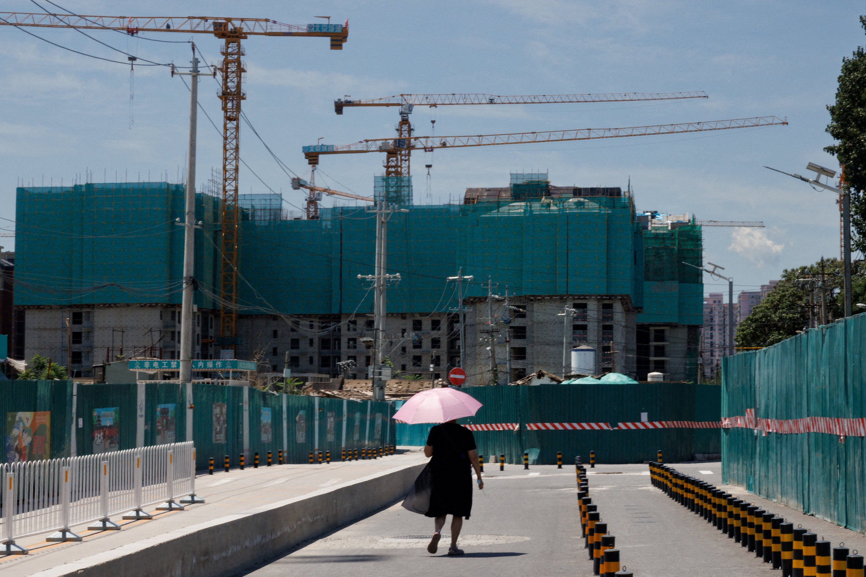 A residential construction site in Beijing. At a time when so many industry players need capital, large and important ones are likely to be given preference, so that regulators can restore confidence in the industry, an analyst says. Photo: Reuters