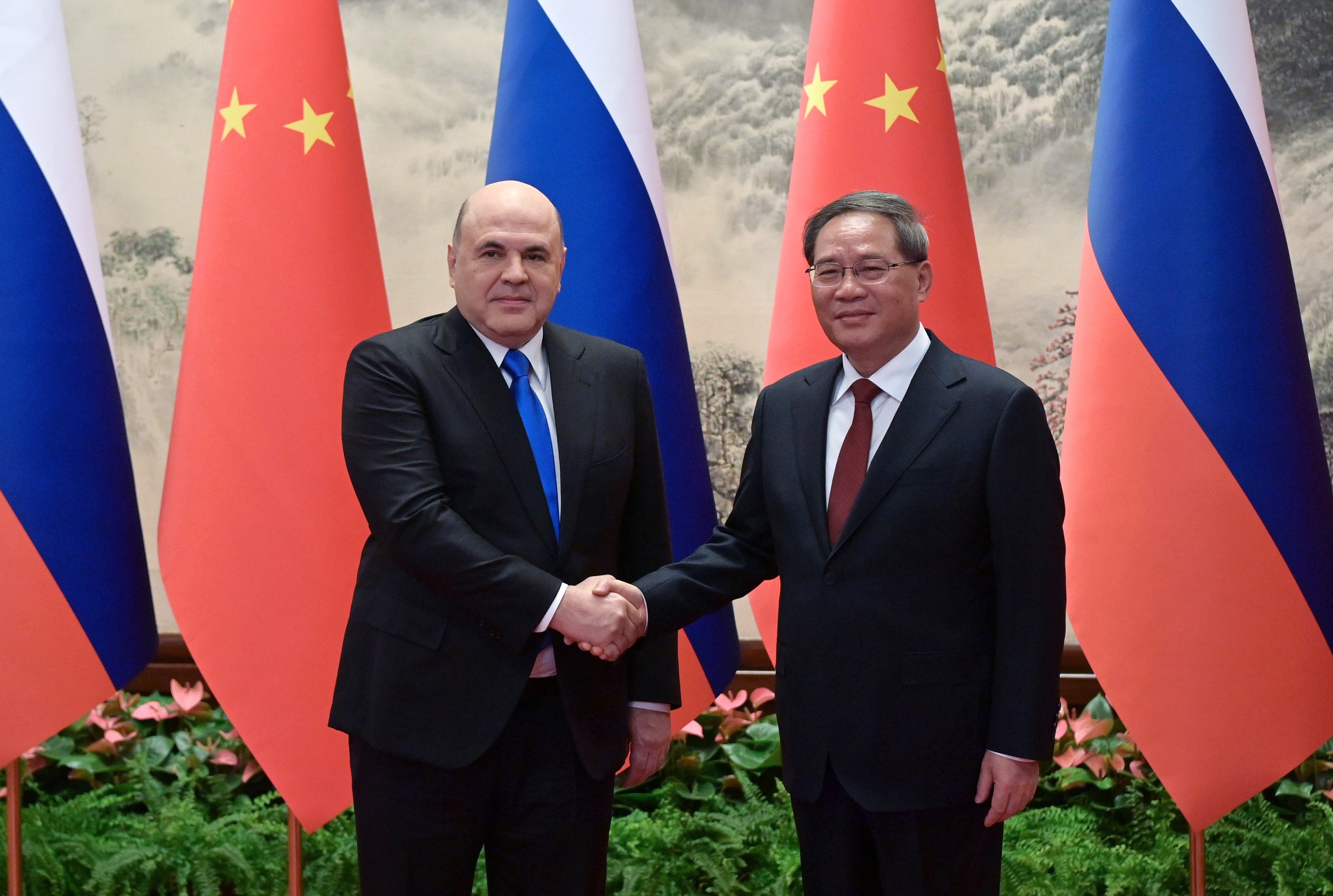 Russian Prime Minister Mikhail Mishustin and Chinese Premier Li Qiang in Beijing. Photo: EPA-EFE