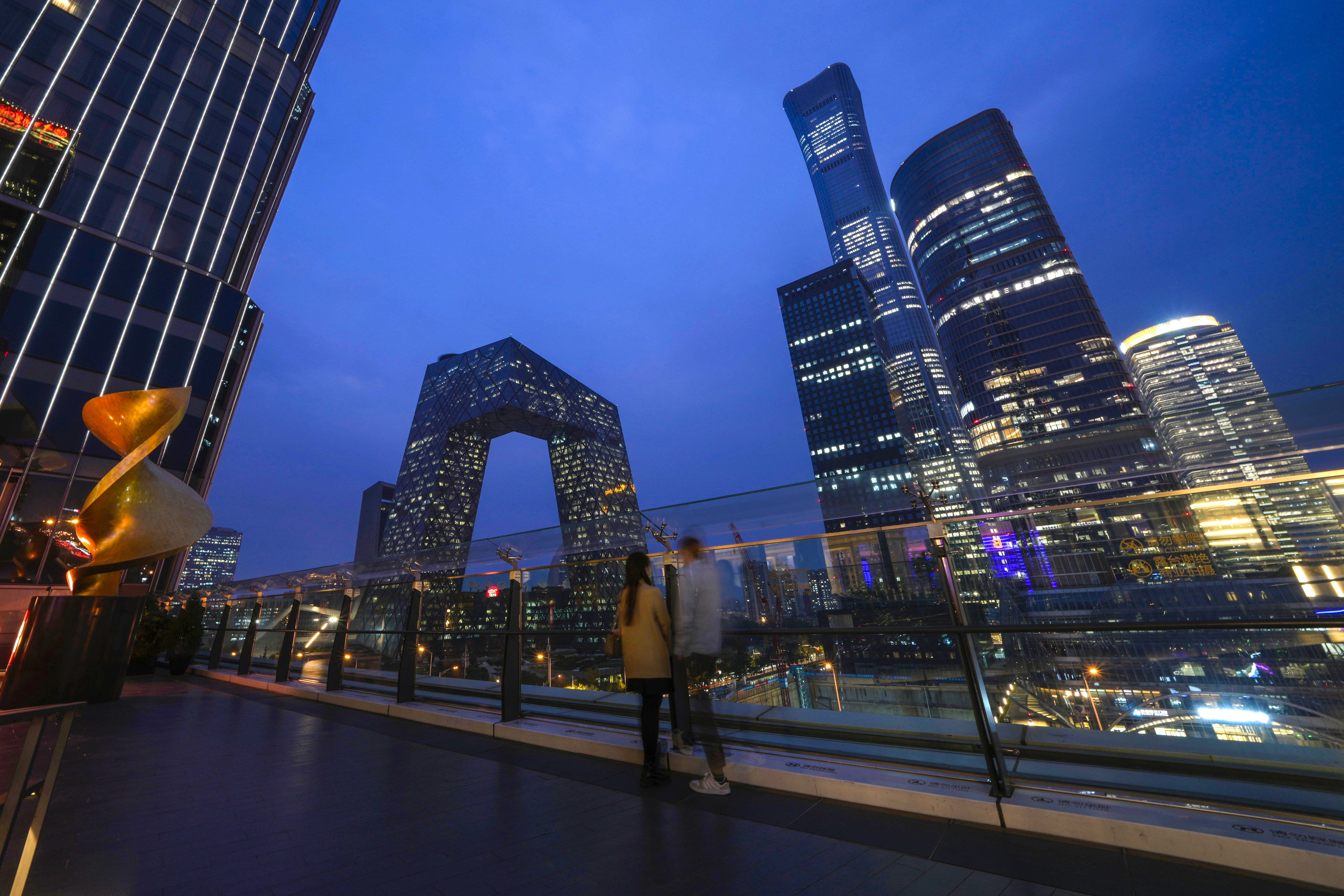 People linger in the Central Business District of Beijing on October 26, 2022. Photo: AP