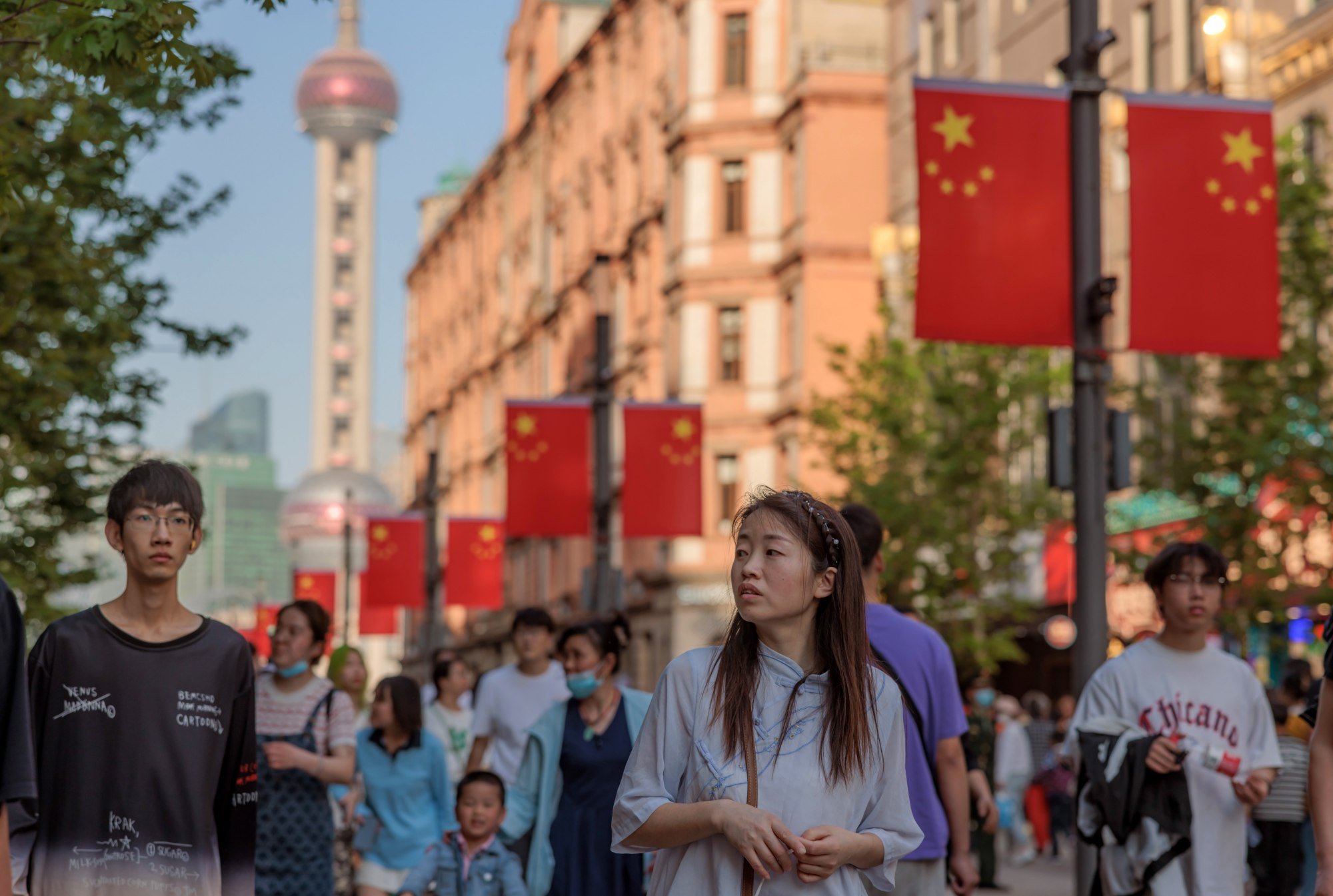 People stroll along Nanjing Road, Shanghai’s main pedestrianised shopping area, on May 1. Photo: EPA-EFE
