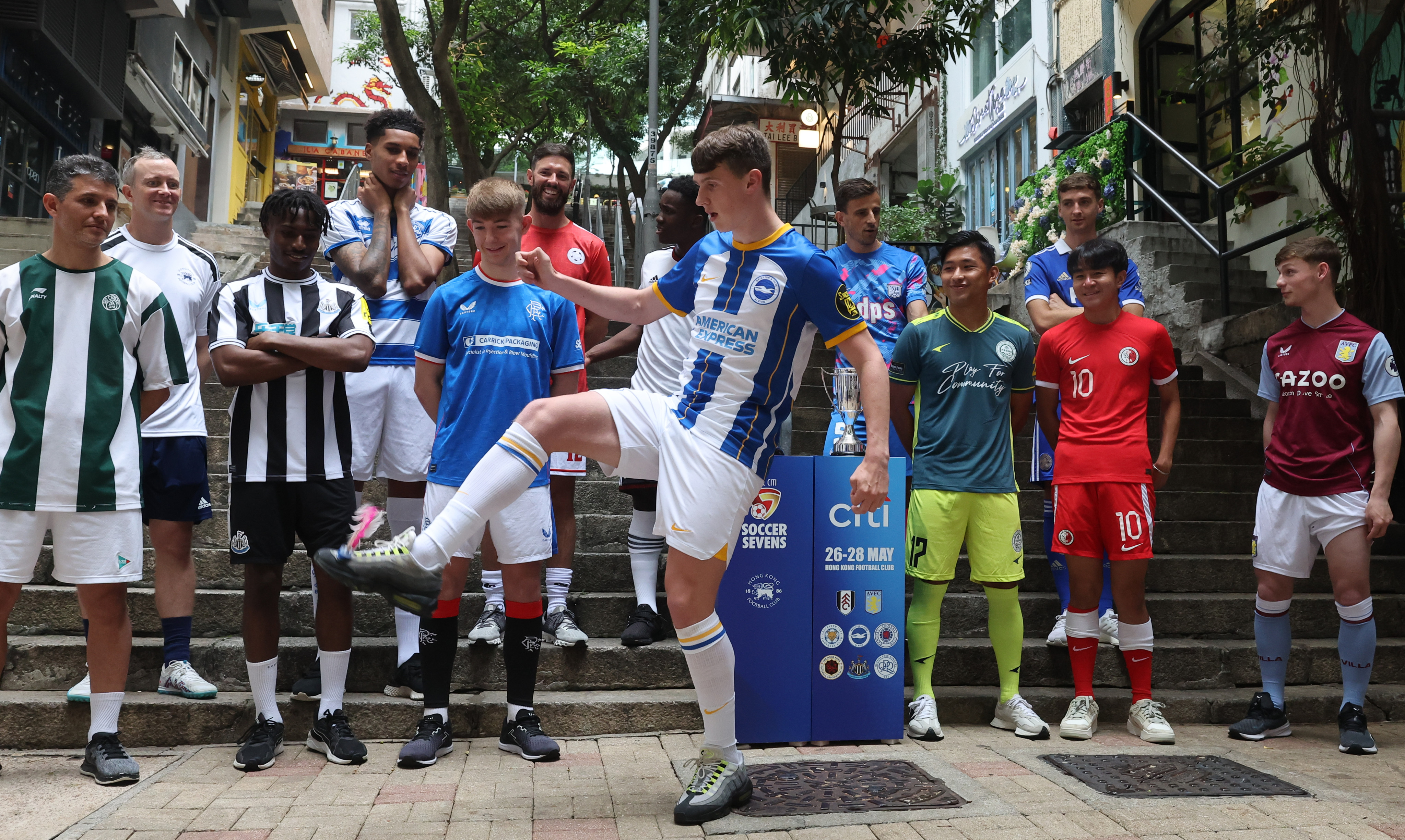 Jack Hinchy of Brighton tries out shuttlecock in Hong Kong, watched by his fellow Soccer Sevens captains. Photo: Edmond So