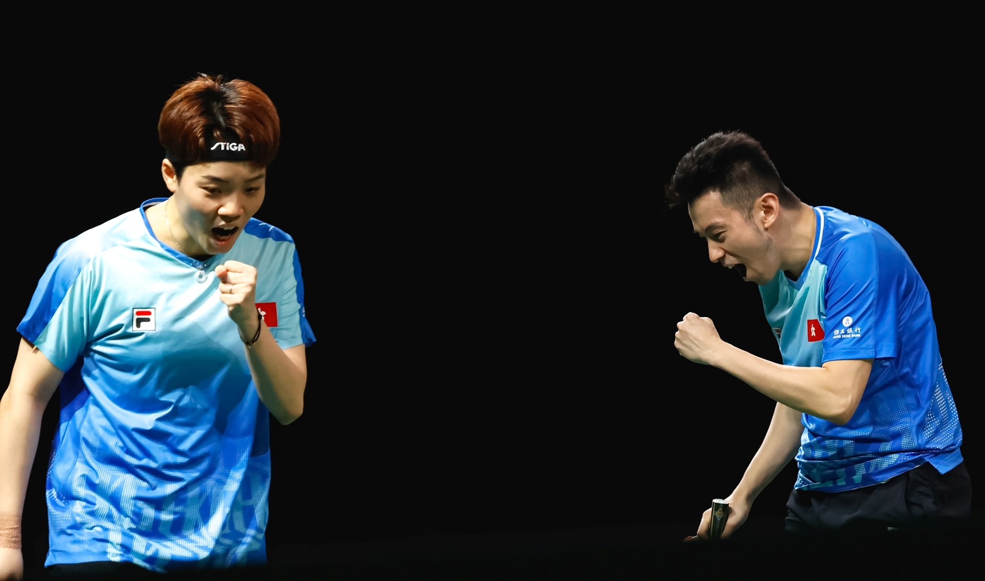 Doo Hoi-kem (left) and Wong Chun-ting clinch a place on the podium as they defeat Swedish pair Truls Moregard and Christina Kallberg. Photo: World Table Tennis
