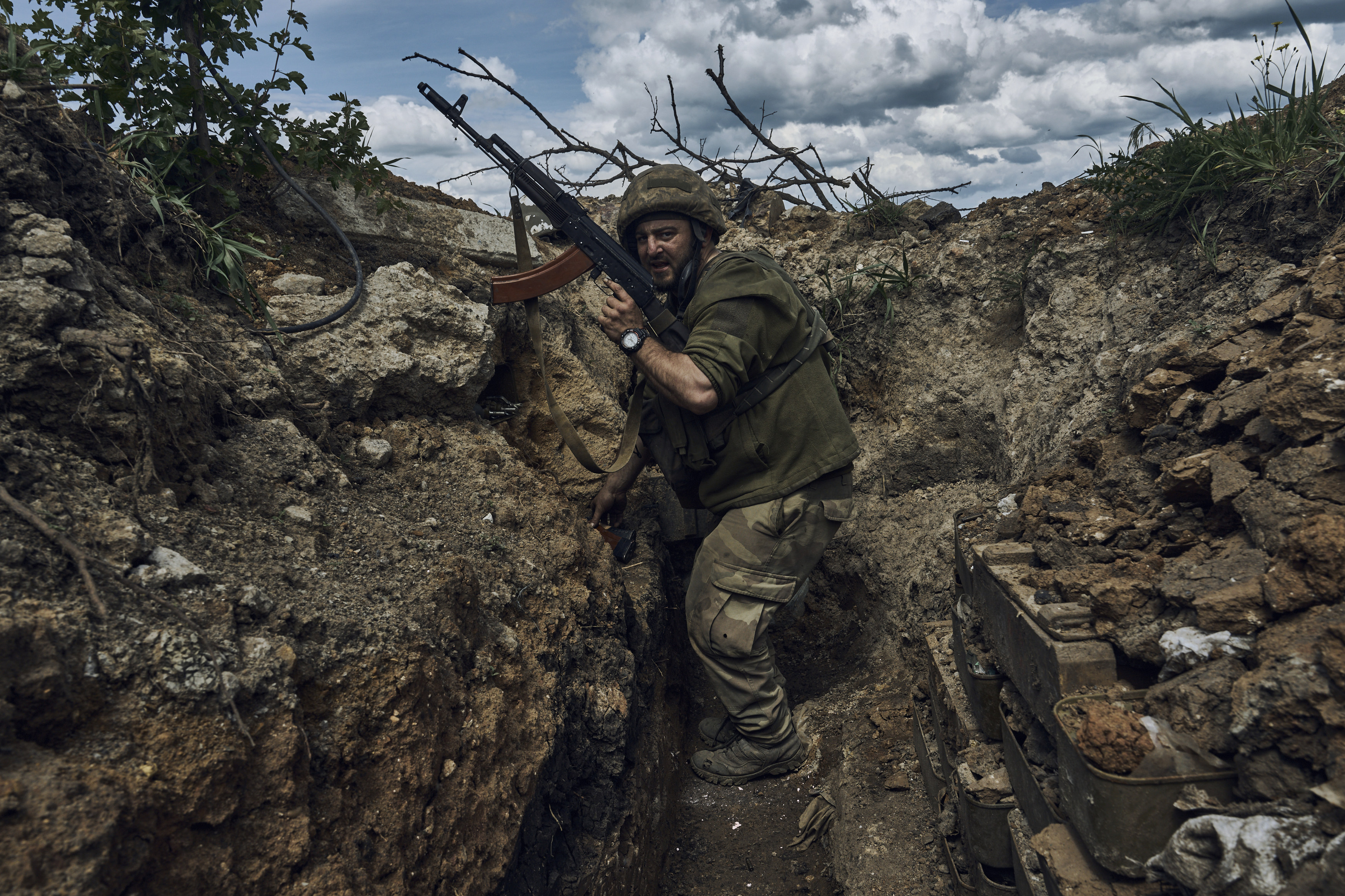 A Ukrainian soldier in a trench at the front line near Bakhmut in the Donetsk region, Ukraine. Photo: AP