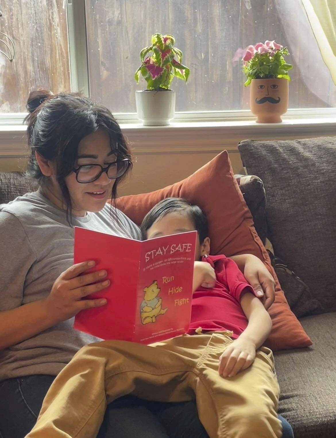 Cindy Campos reads the book “Stay Safe” to her son in Dallas, Texas. Photo: Cindy Campos via AP