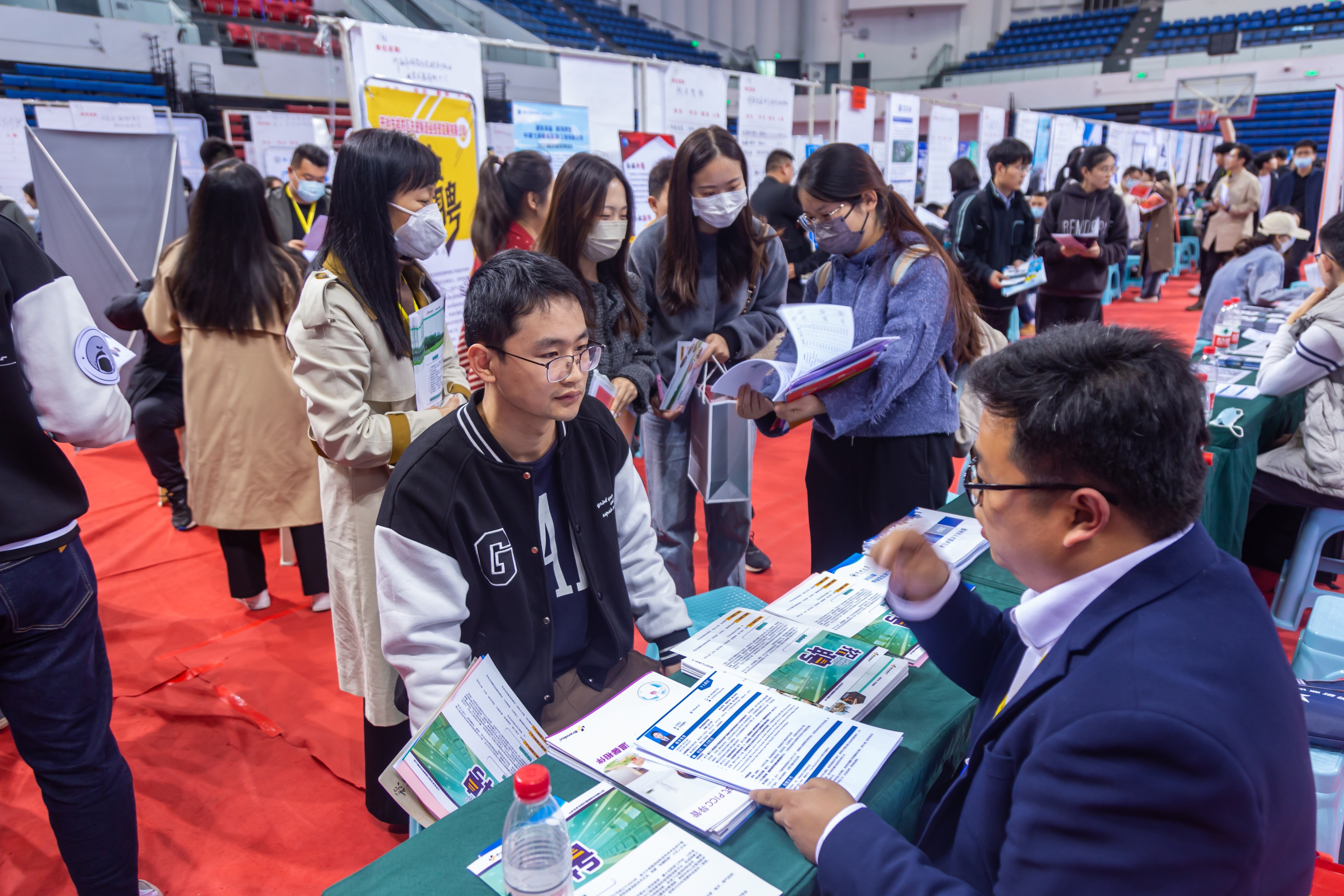 Graduates attend a job fair at Zhengzhou University in Henan province, China, on April 21. The number of jobless youth is likely to increase in June, when 11.6 million fresh graduates flood the market. Photo: Getty Images