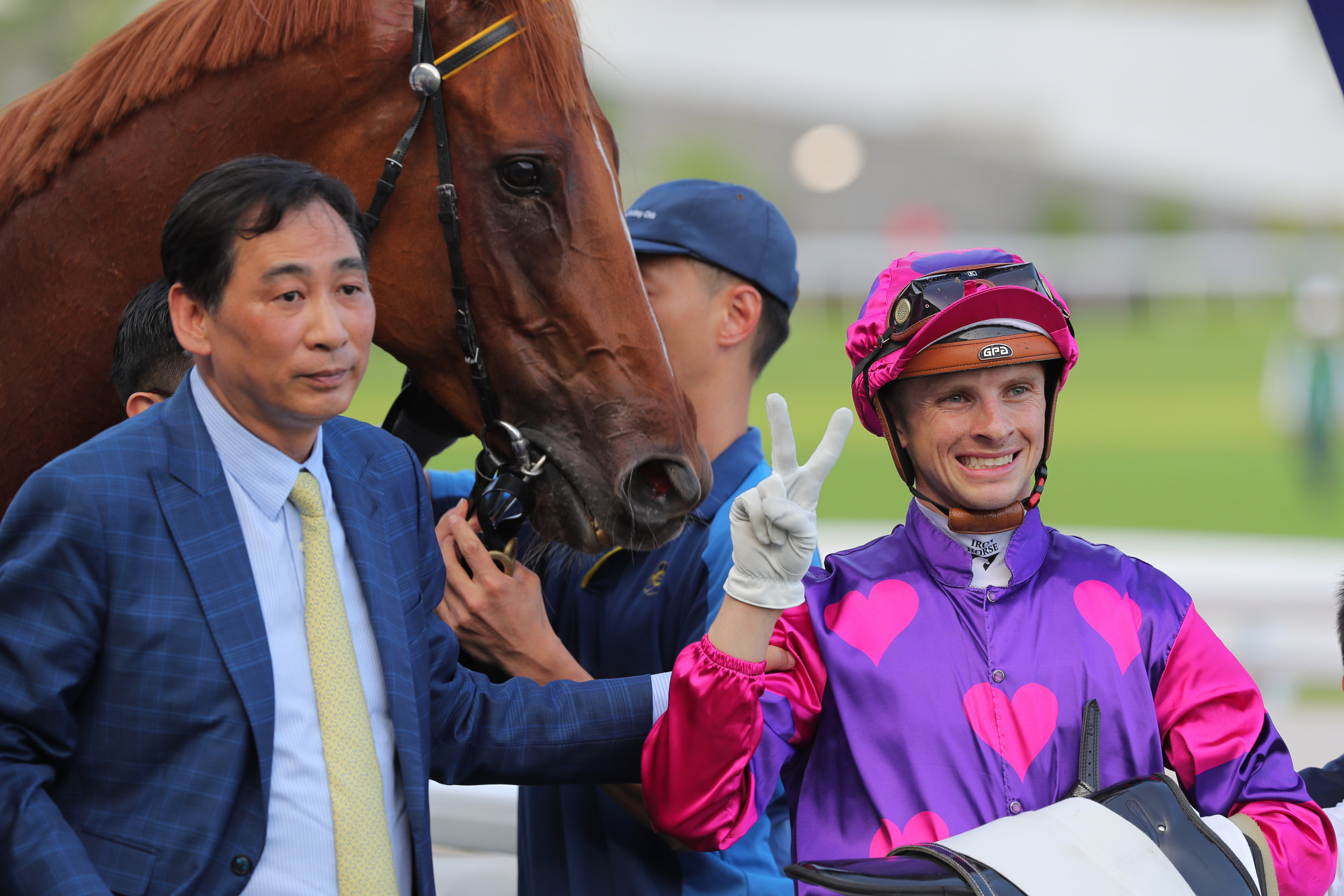 Trainer Michael Chang and jockey Lyle Hewitson soak up Ching’s victory.