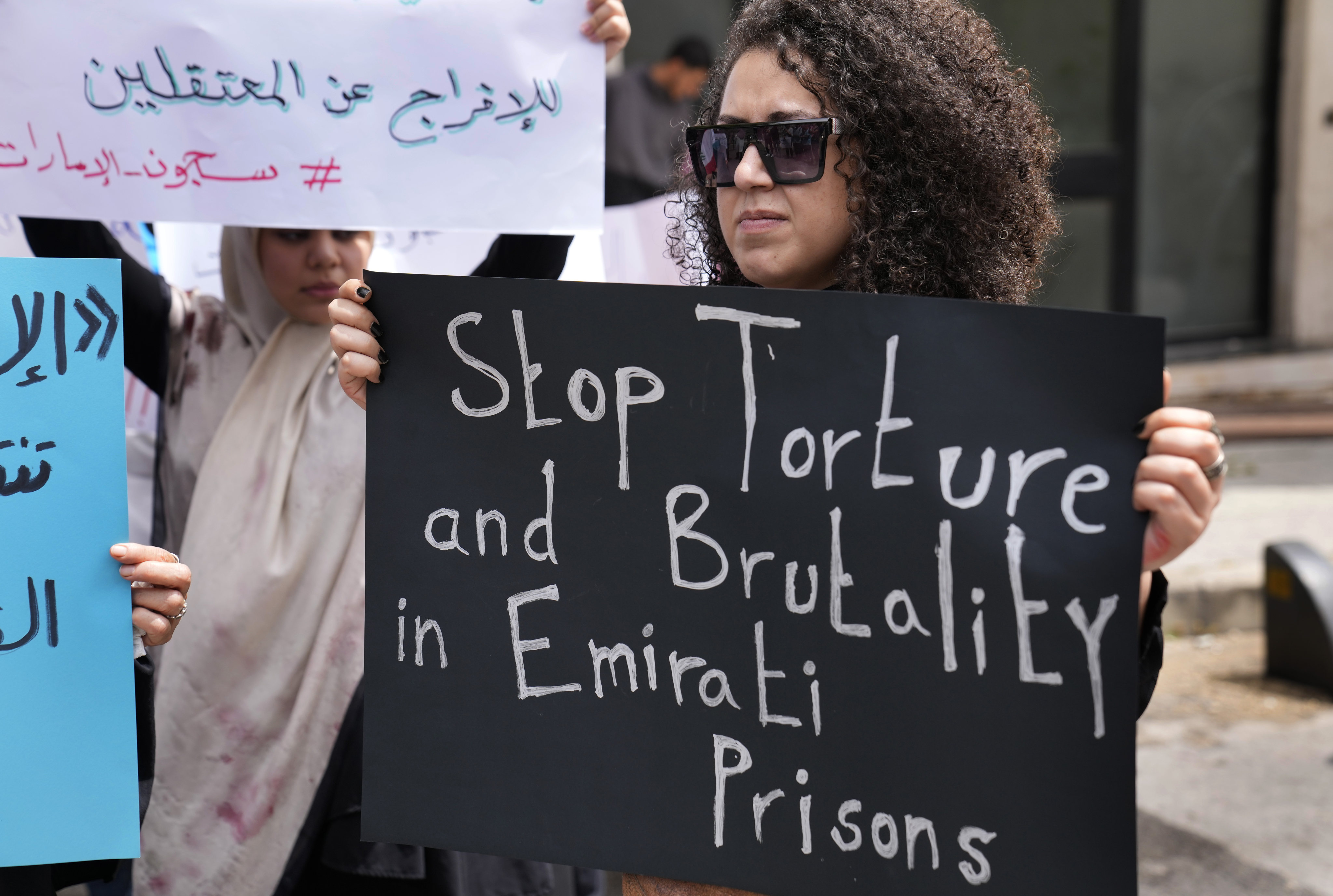 A supporter of Lebanese citizens detained in the United Arab Emirates protests in front of the Foreign Ministry headquarters in downtown Beirut, Lebanon on May 15. The 10 prisoners were freed on Saturday. Photo: AP