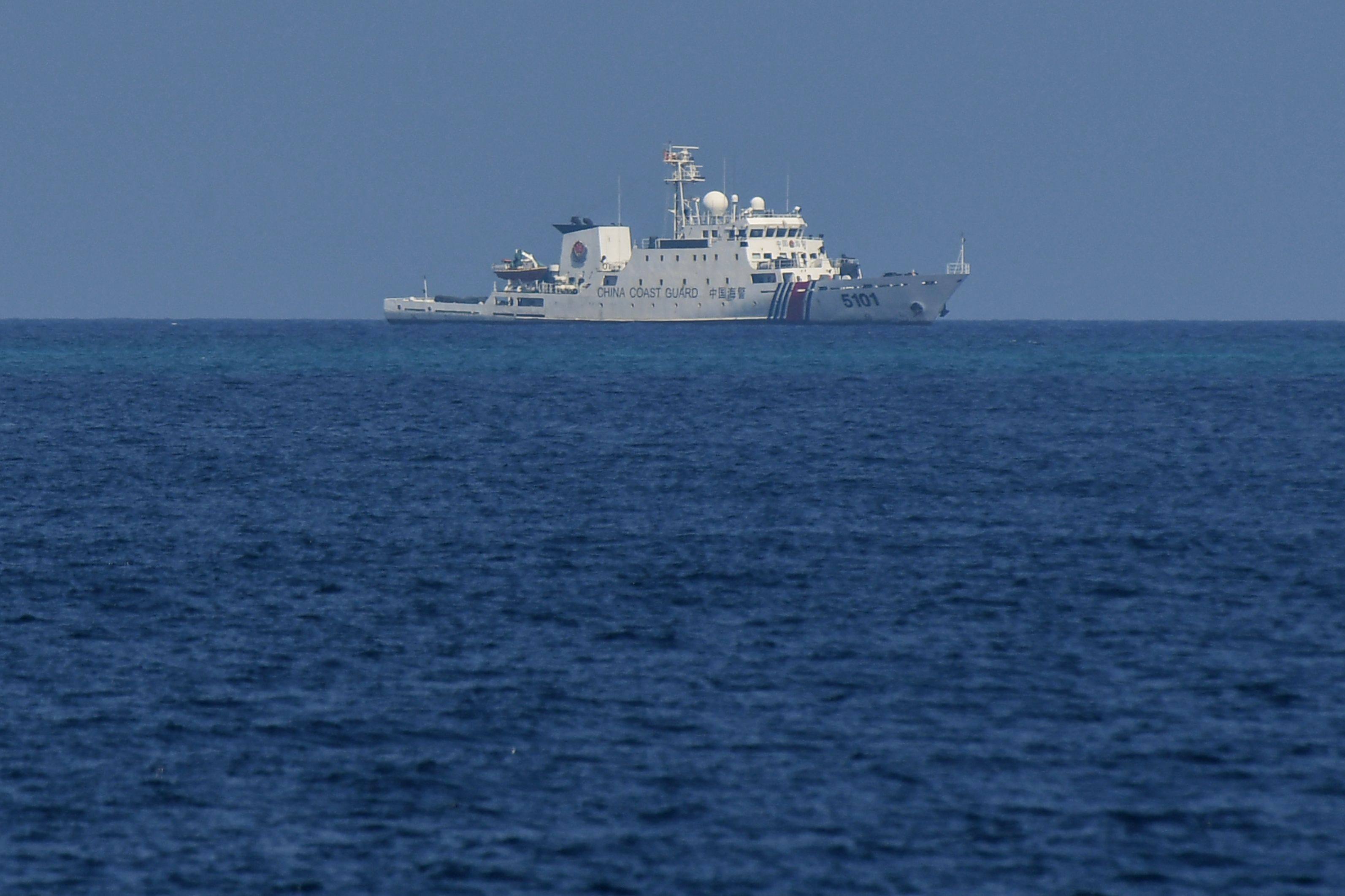 A Chinese coastguard ship patrols near the Philippine-occupied Thitu island in the disputed South China Sea in April 2023. Photo: AFP