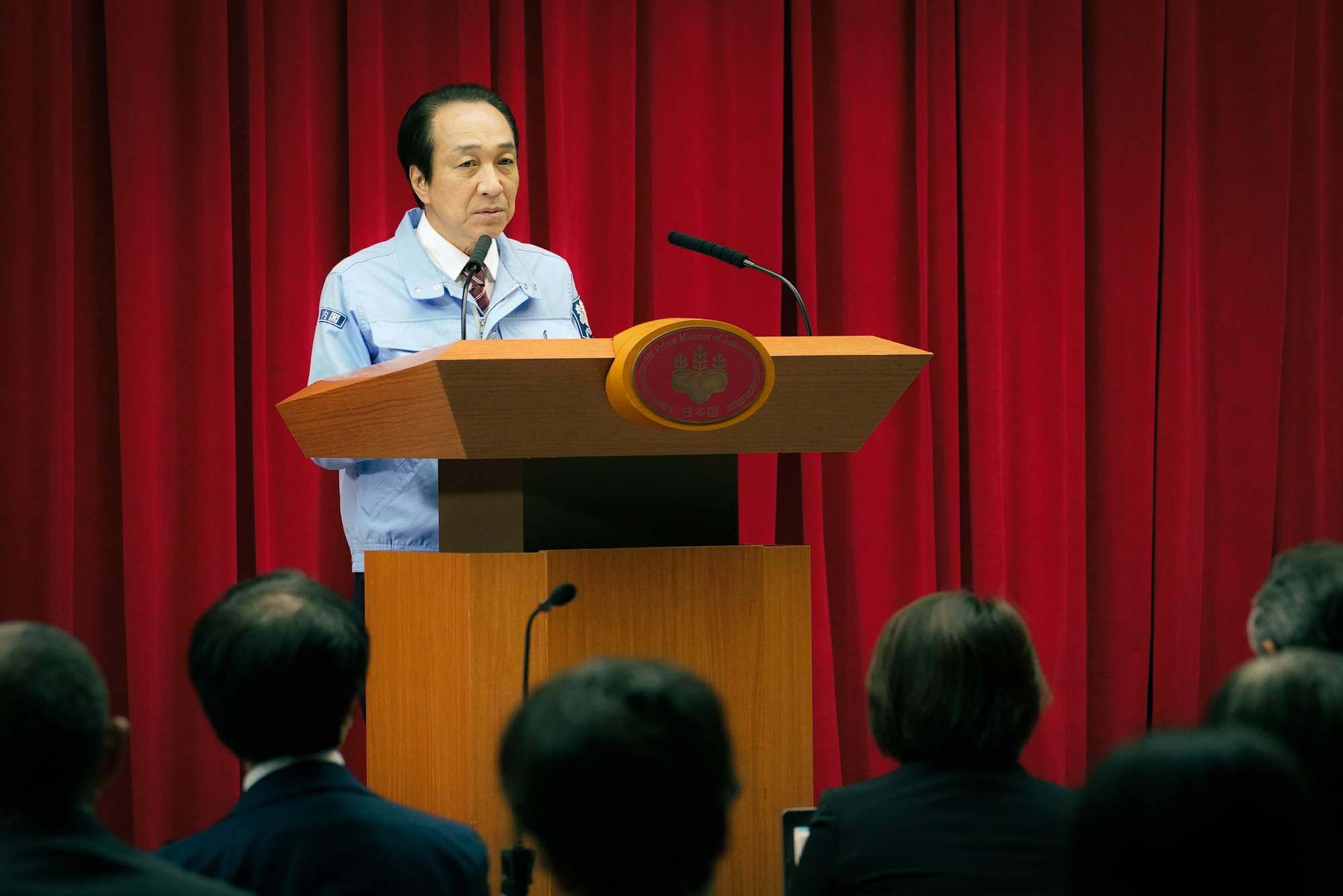 Fumiyo Kohinata as the Japanese Prime Minister in a still from “The Days”. Photo: Netflix