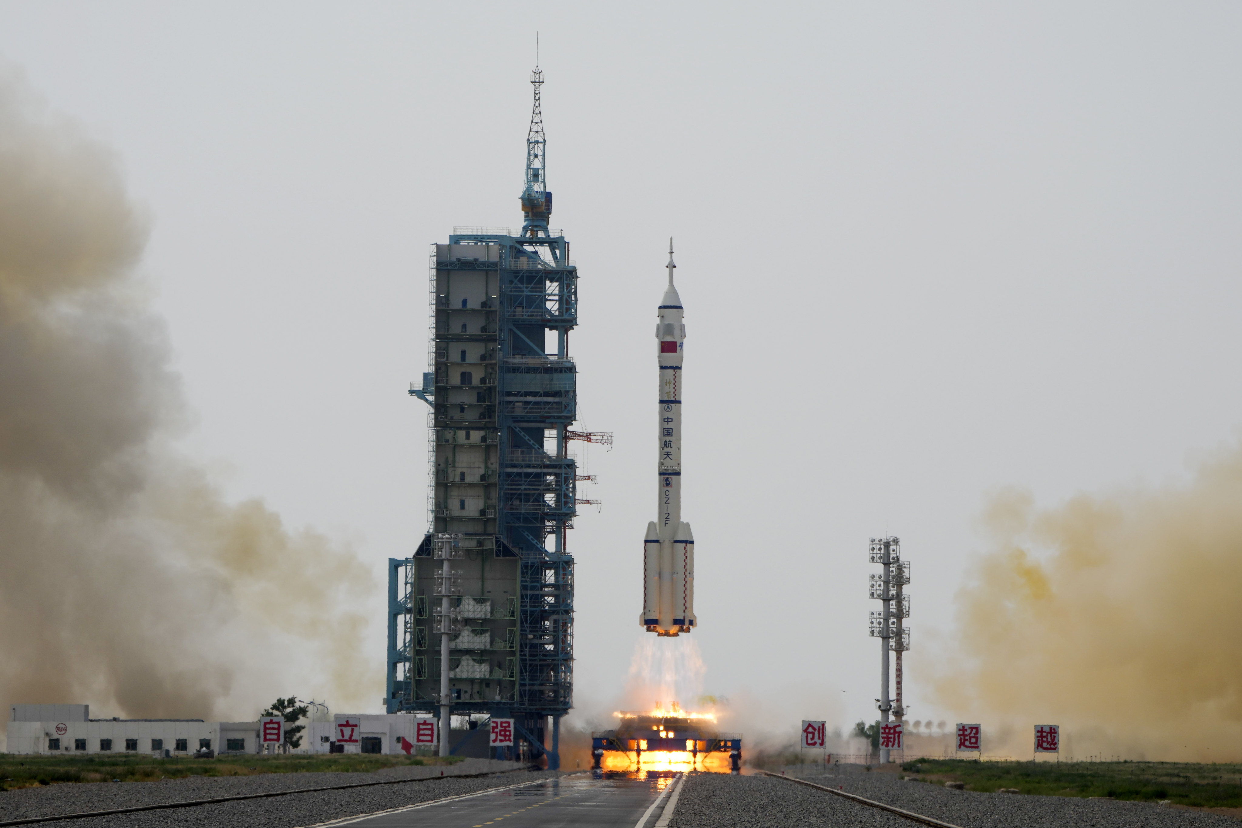 A rocket carrying a crew of Chinese astronauts in a spaceship lifts off at the Jiuquan Satellite Launch Centre. Photo: AP