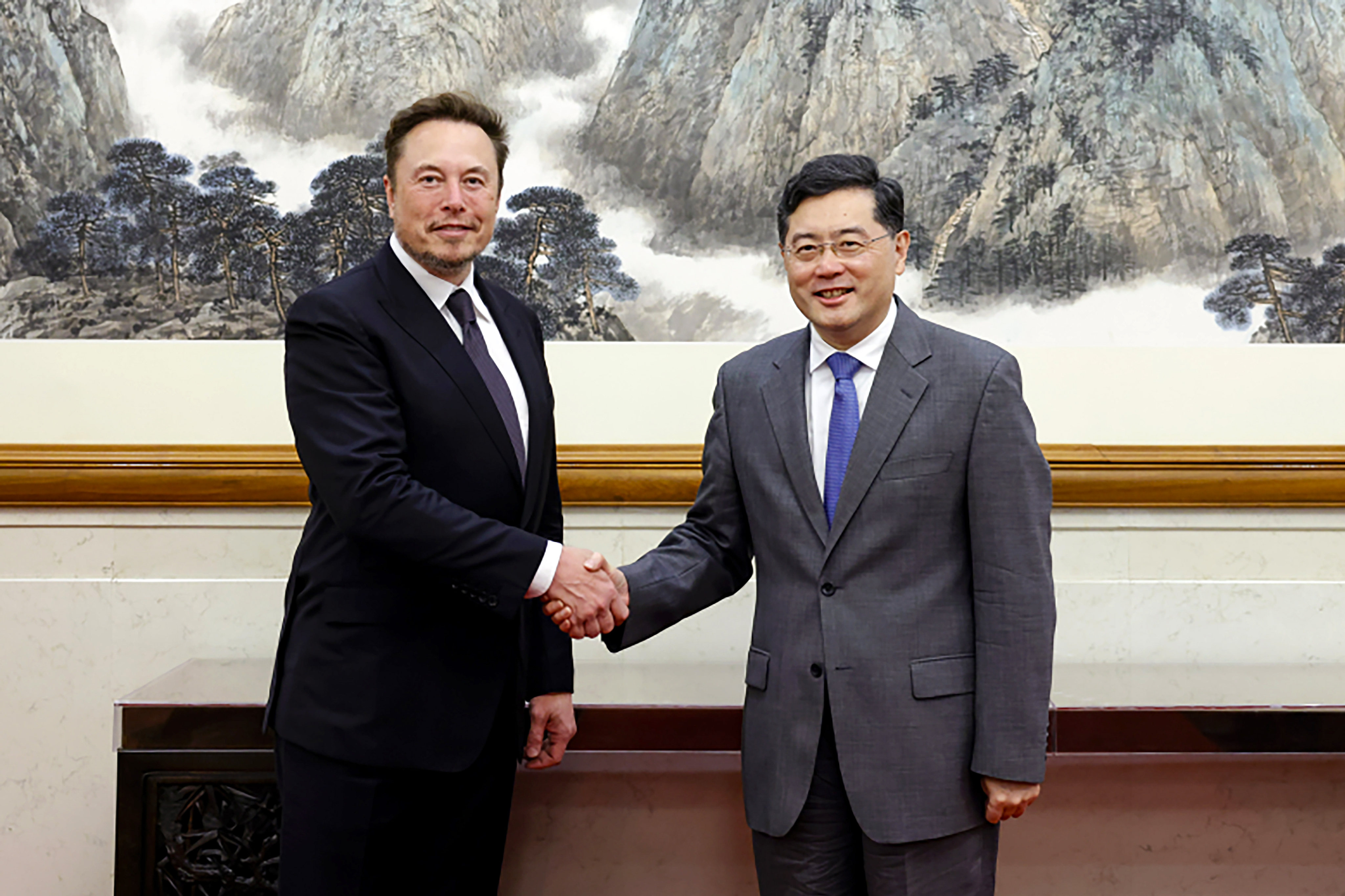 Chinese Foreign Minister Qin Gang (right) meets Tesla CEO Elon Musk in Beijing on Tuesday. Photo: AP