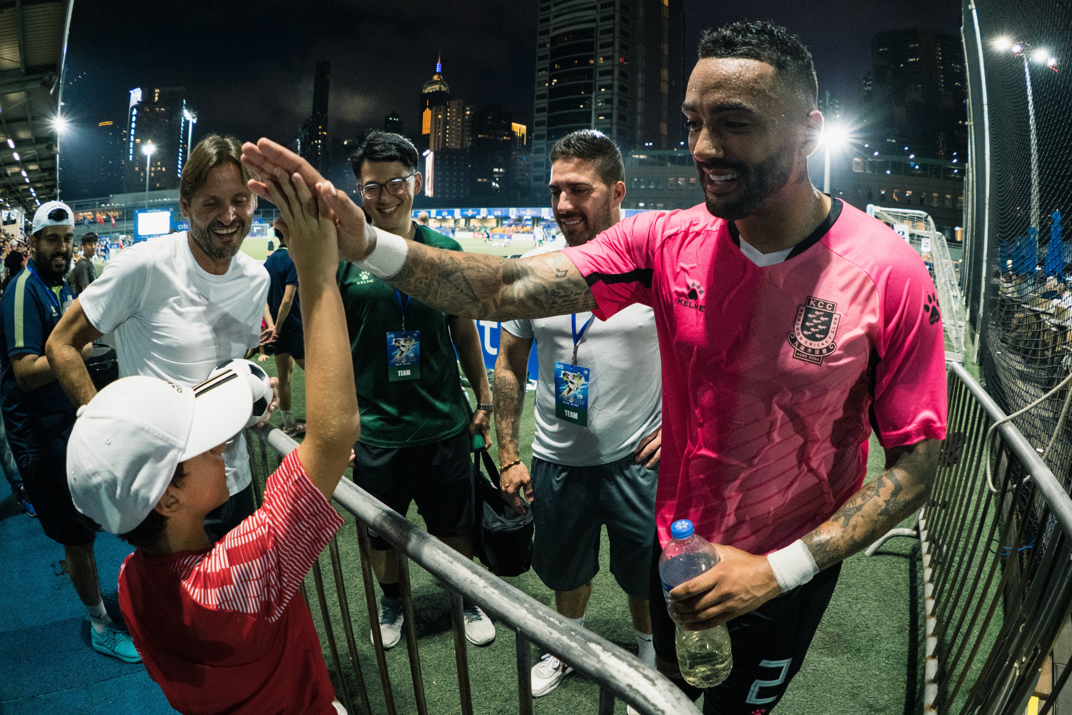 Danny Simpson high-fives a young fan at the 2023 HKFC Citi Soccer Sevens at Hong Kong Football Club. Photo: Nicholas Kang