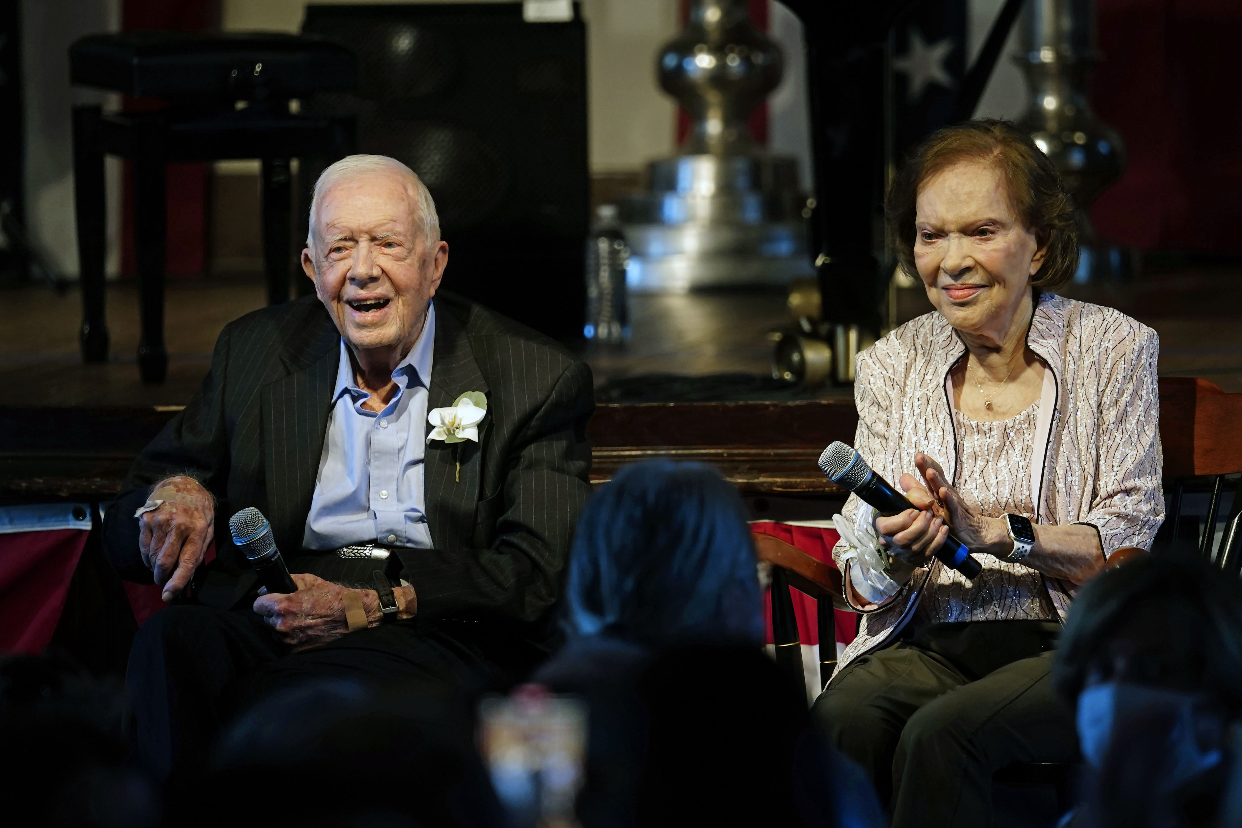 Former US president Jimmy Carter and former first lady Rosalynn Carter sit together during a reception to celebrate their 75th wedding anniversary in July 2021 in Plains, Georgia. Photo: AP