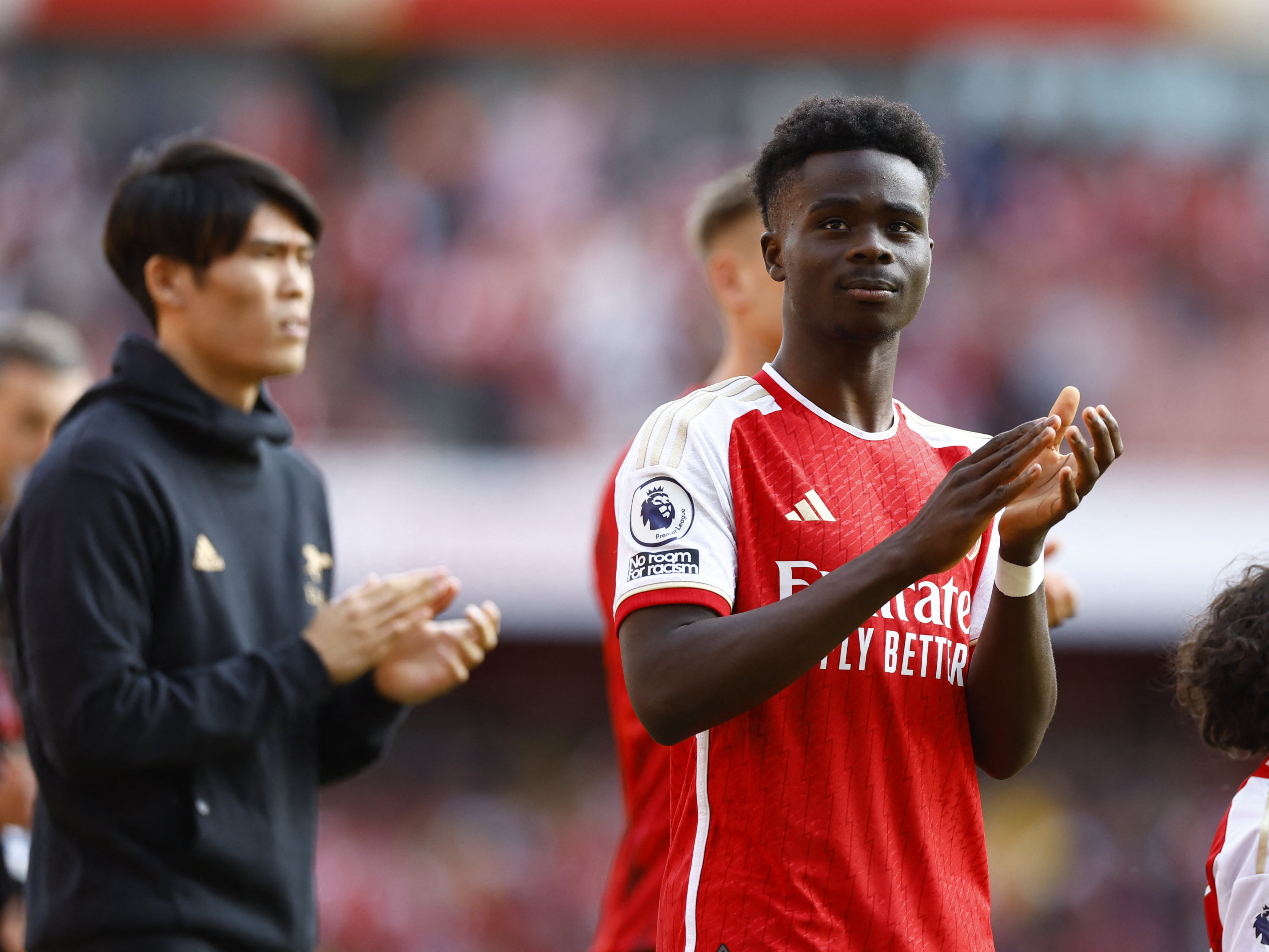 Arsenal’s Bukayo Saka applauds his club’s fans on the final day of the season after their title challenge tailed off. Photo: Reuters