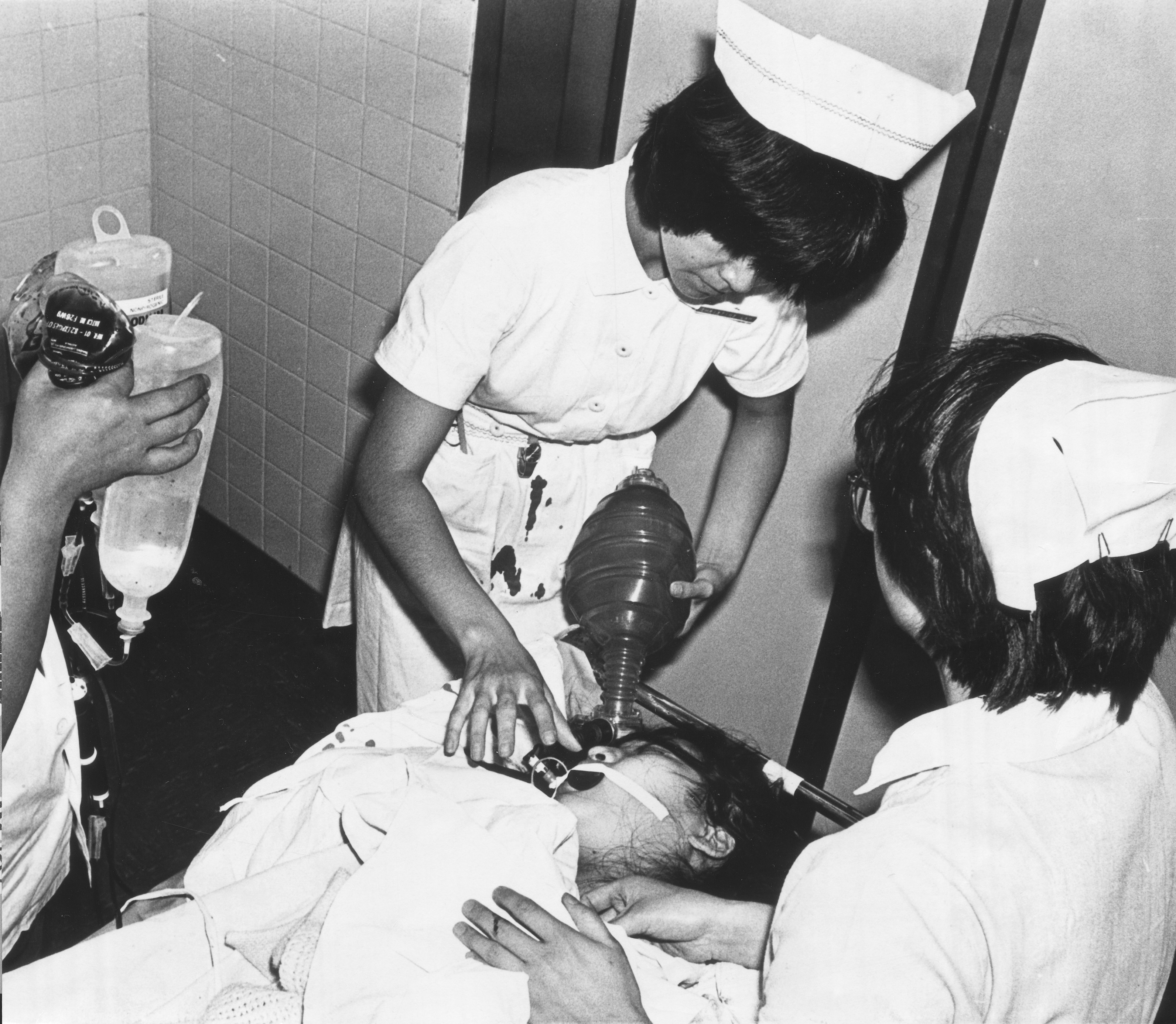 Nurses at Caritas Hospital in Cheung Sha Wan, Hong Kong, attend to one of the seriously injured victims of a mass wounding at a kindergarten in 1982. A schizophrenic armed with two knives slashed 34 children before being stopped, having earlier killed his mother and sister. Photo: SCMP