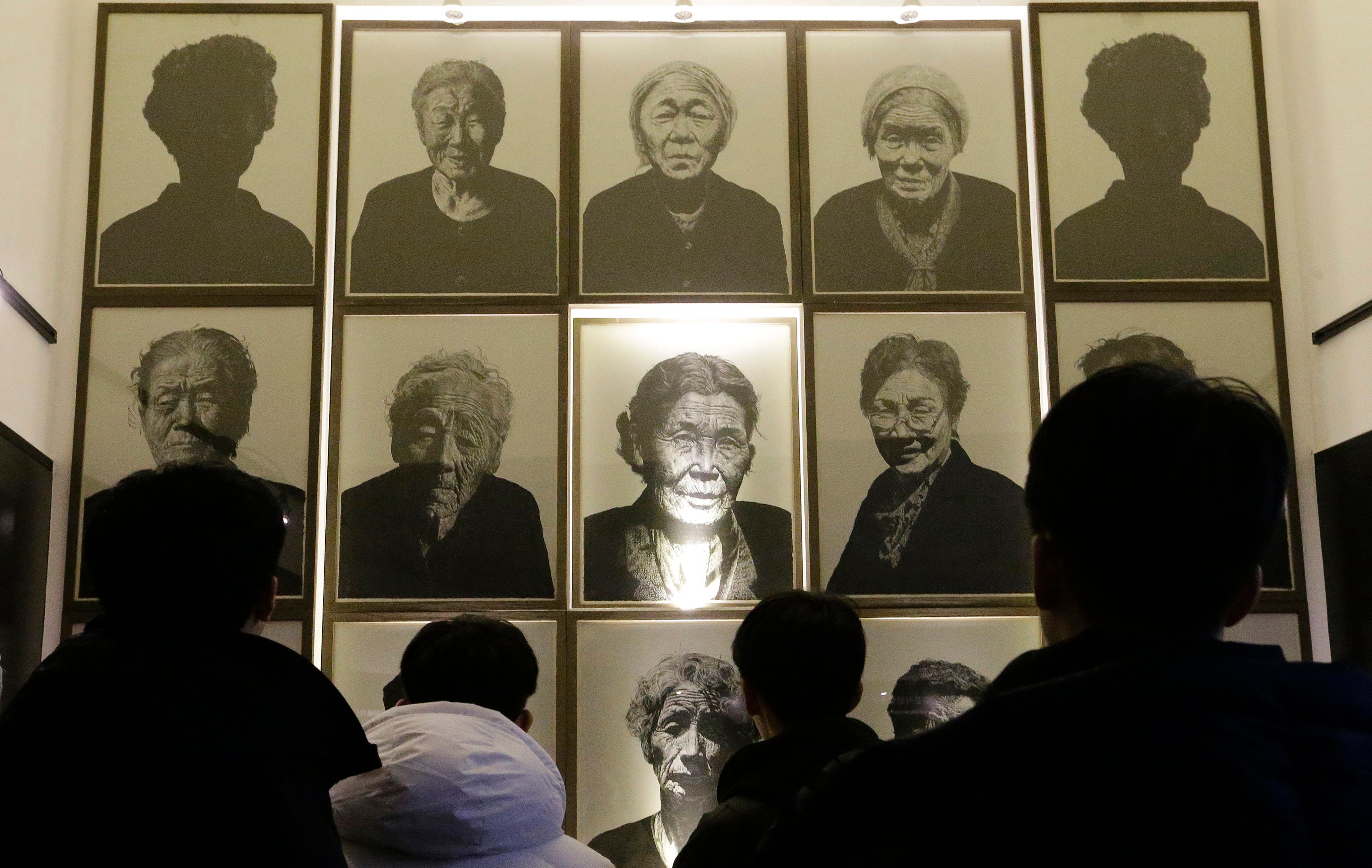 Portraits of late former sex slaves who were forced to serve for the Japanese Army during World War II in South Korea. Photo: AP