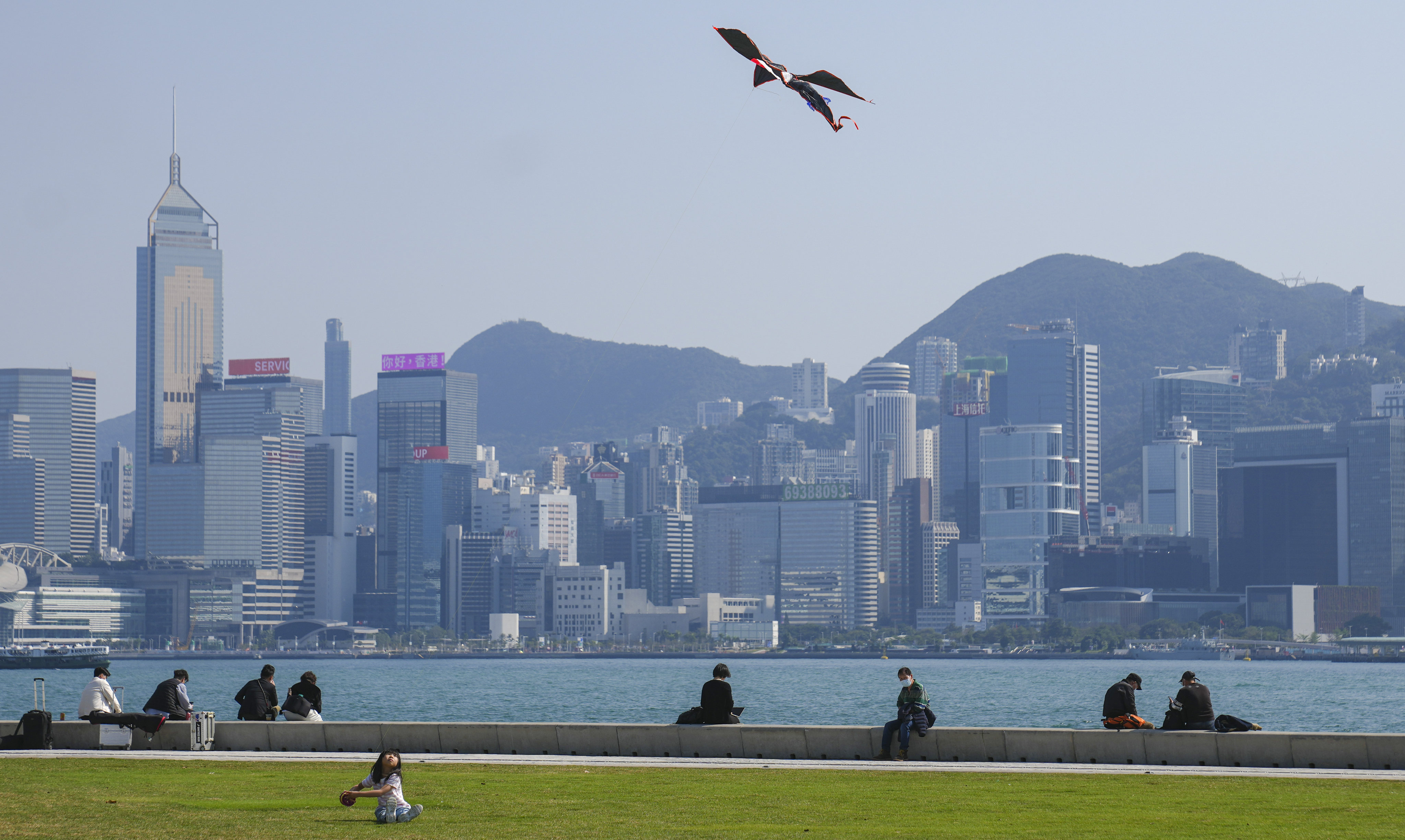 A girl flying a kite at the waterfront of West Kowloon Cultural District.   15FEB23   SCMP / Sam Tsang