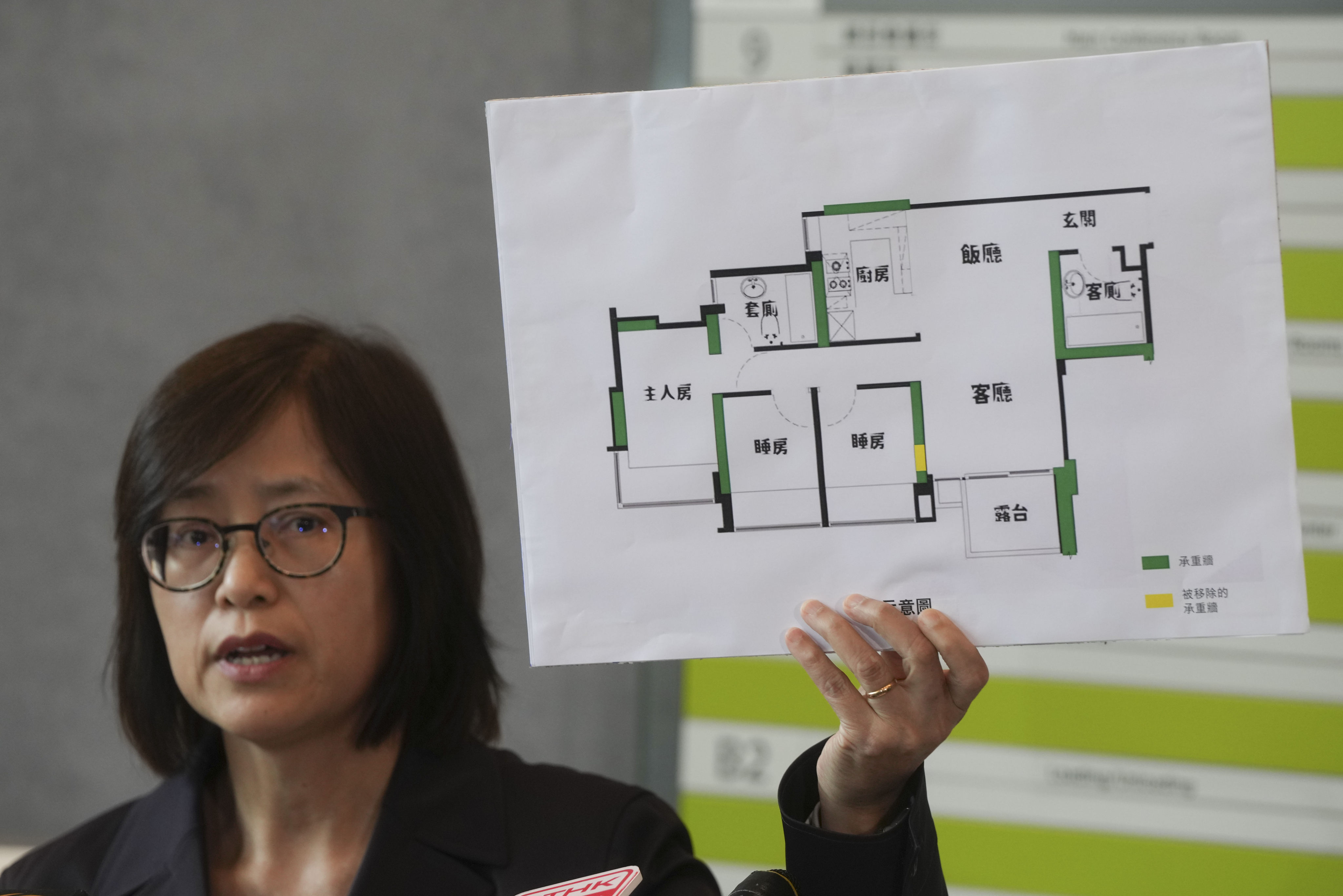 Director of Buildings Clarice Yu Po-mei speaks to reporters on May 30 about the Lohas Park flat where part of a structural wall was removed without approval. Photo: Sam Tsang