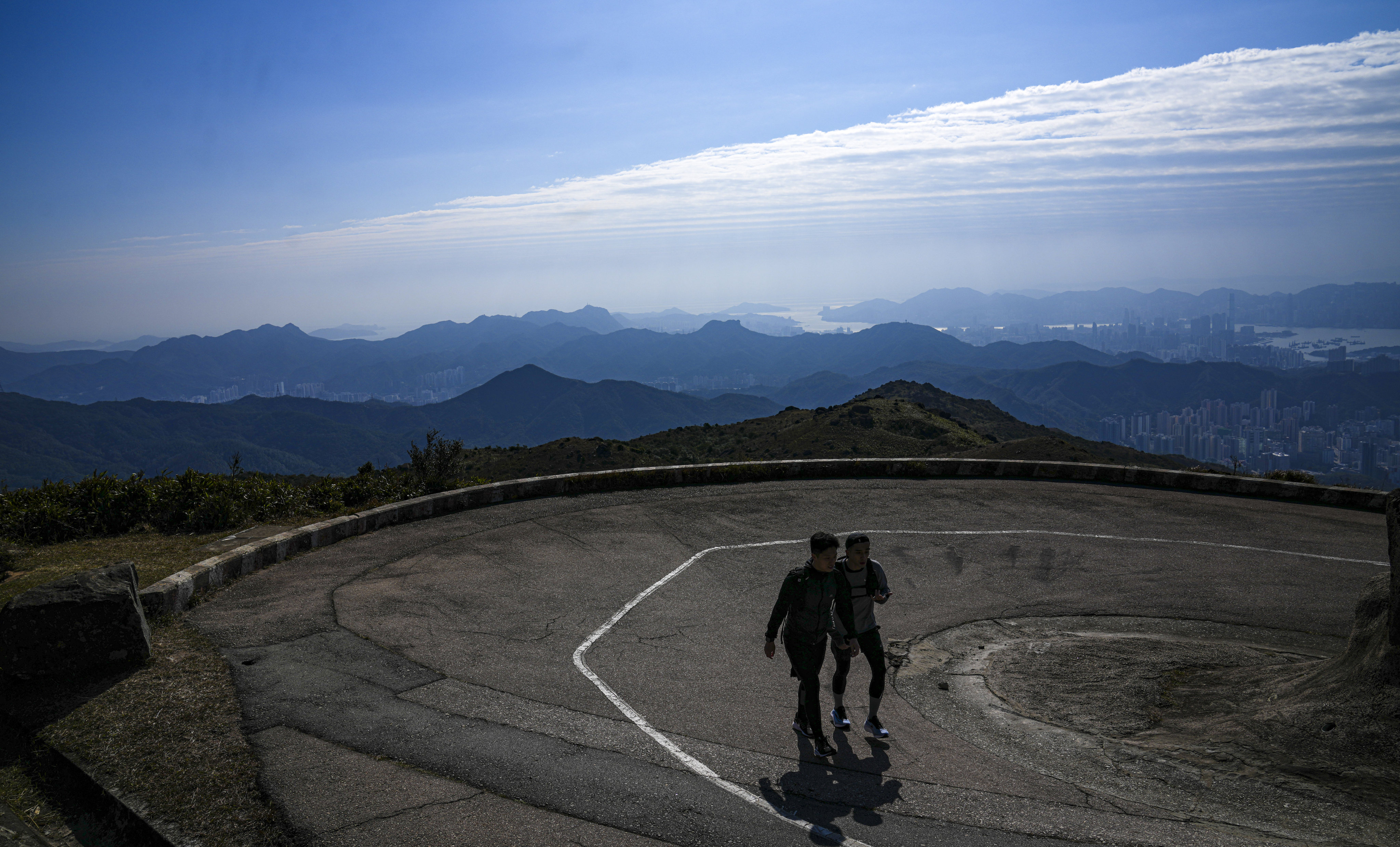 Trekkers take in the view from Tai Mo Shan. Photo: Sam Tsang