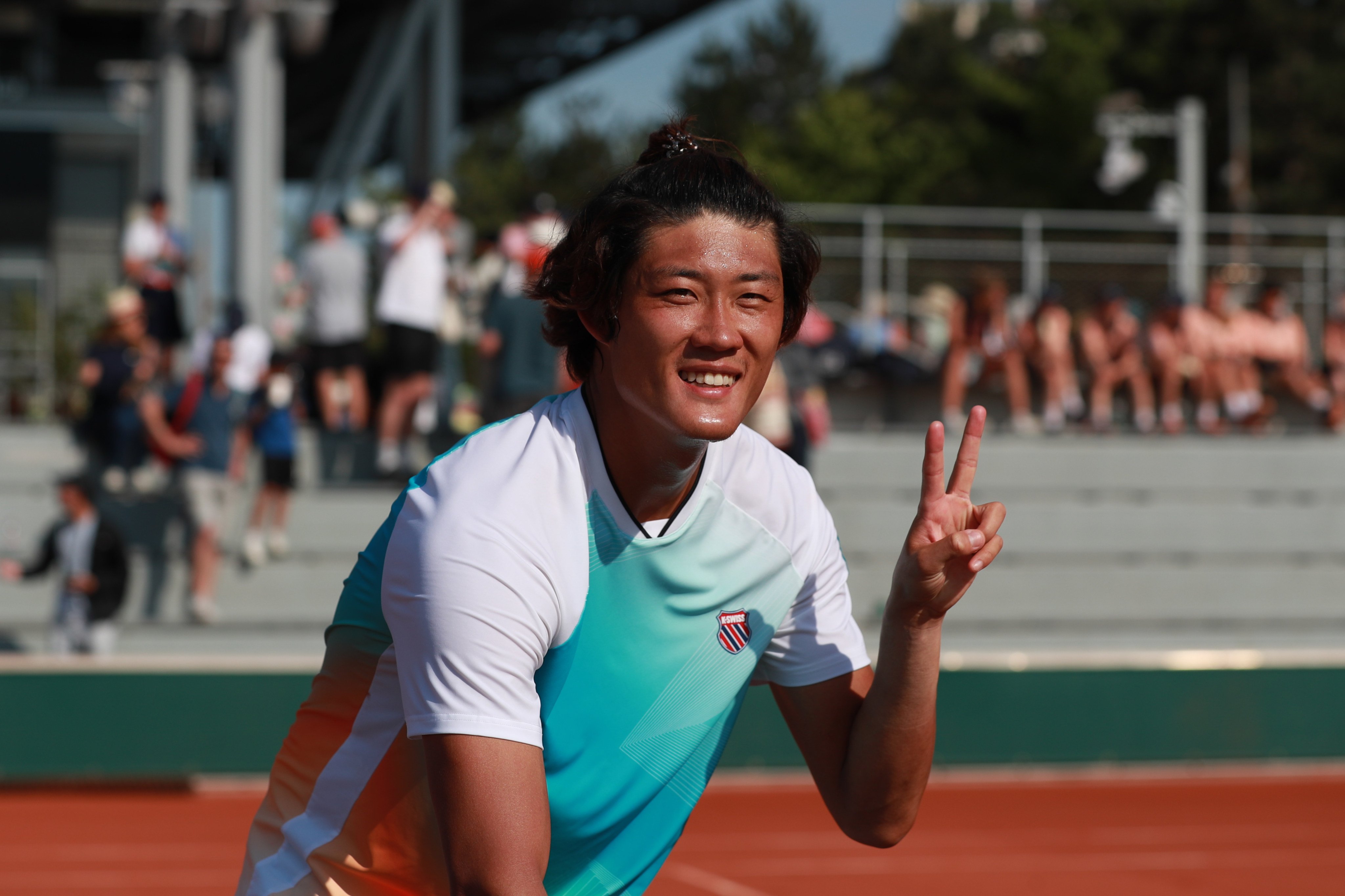 Zhang Zhizhen celebrates  after beating Thiago Agustin Tirante in the second round of the men’s singles at the French Open. Photo: Xinhua
