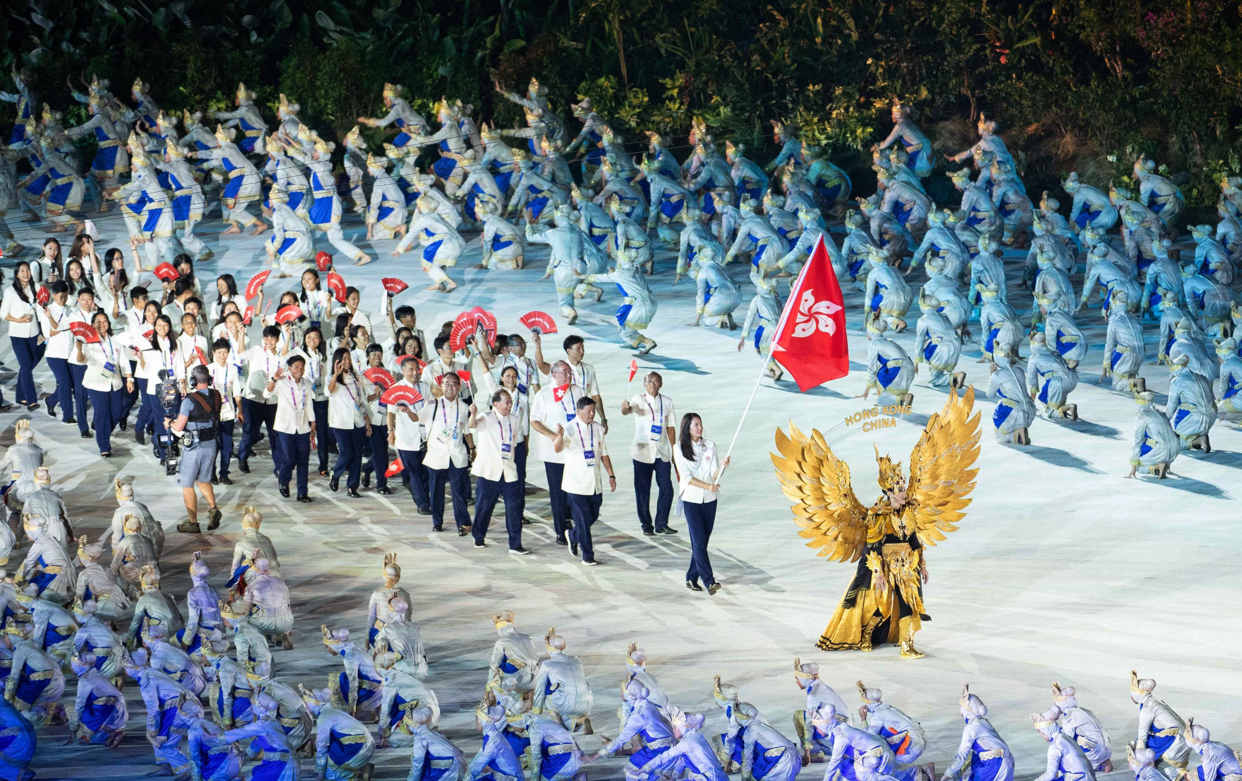 The Hong Kong delegation, led by flag bearer Vivian Kong, arrives at the opening ceremony for the Asian Games in Jakarta. Photo: Xinhua