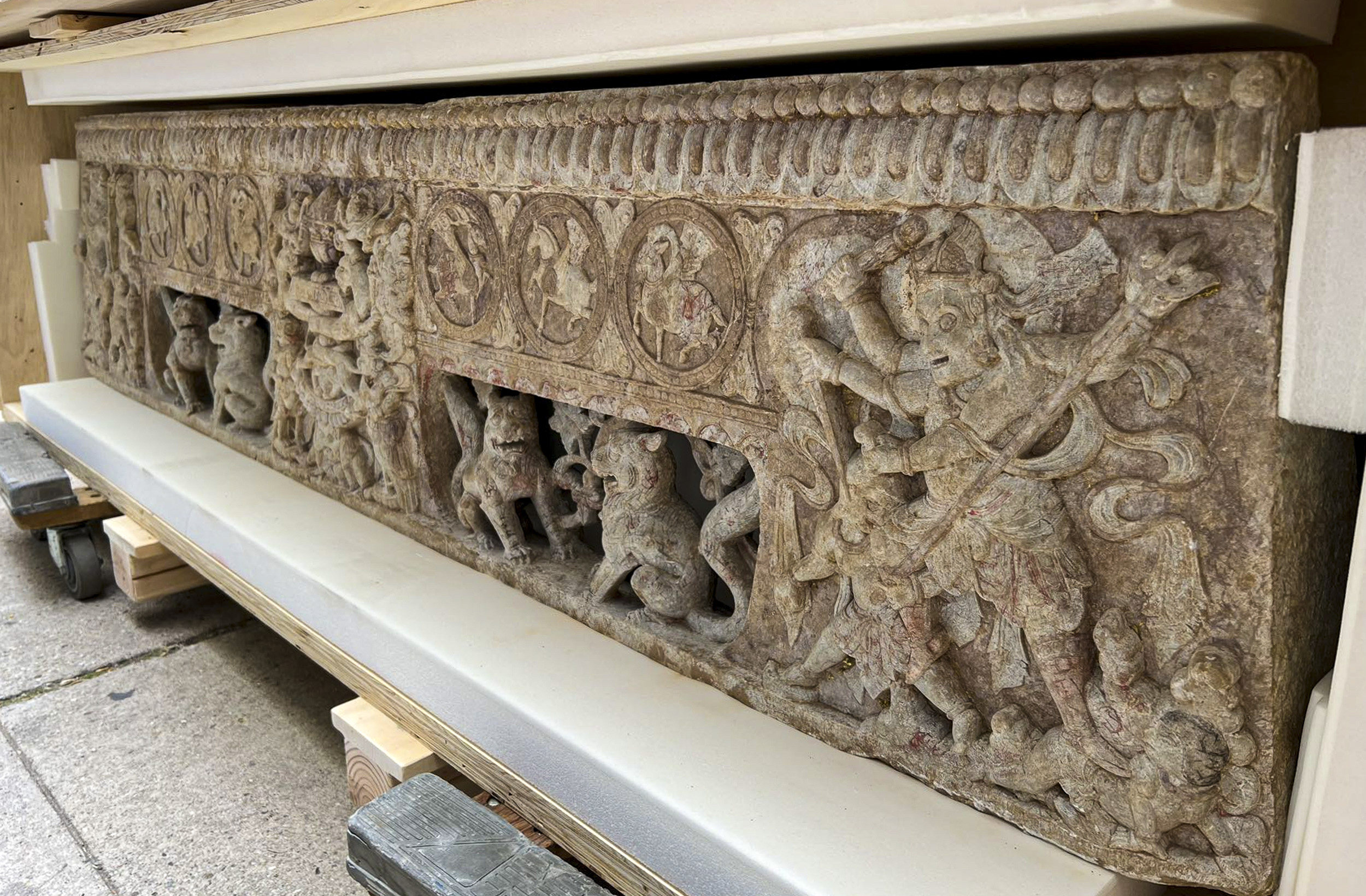Two stone carvings were presented to the Chinese consulate in New York, after an investigation found they were stolen from a tomb in the 1990s and smuggled out of China. Photo: Twitter/@CGHuangPingNY