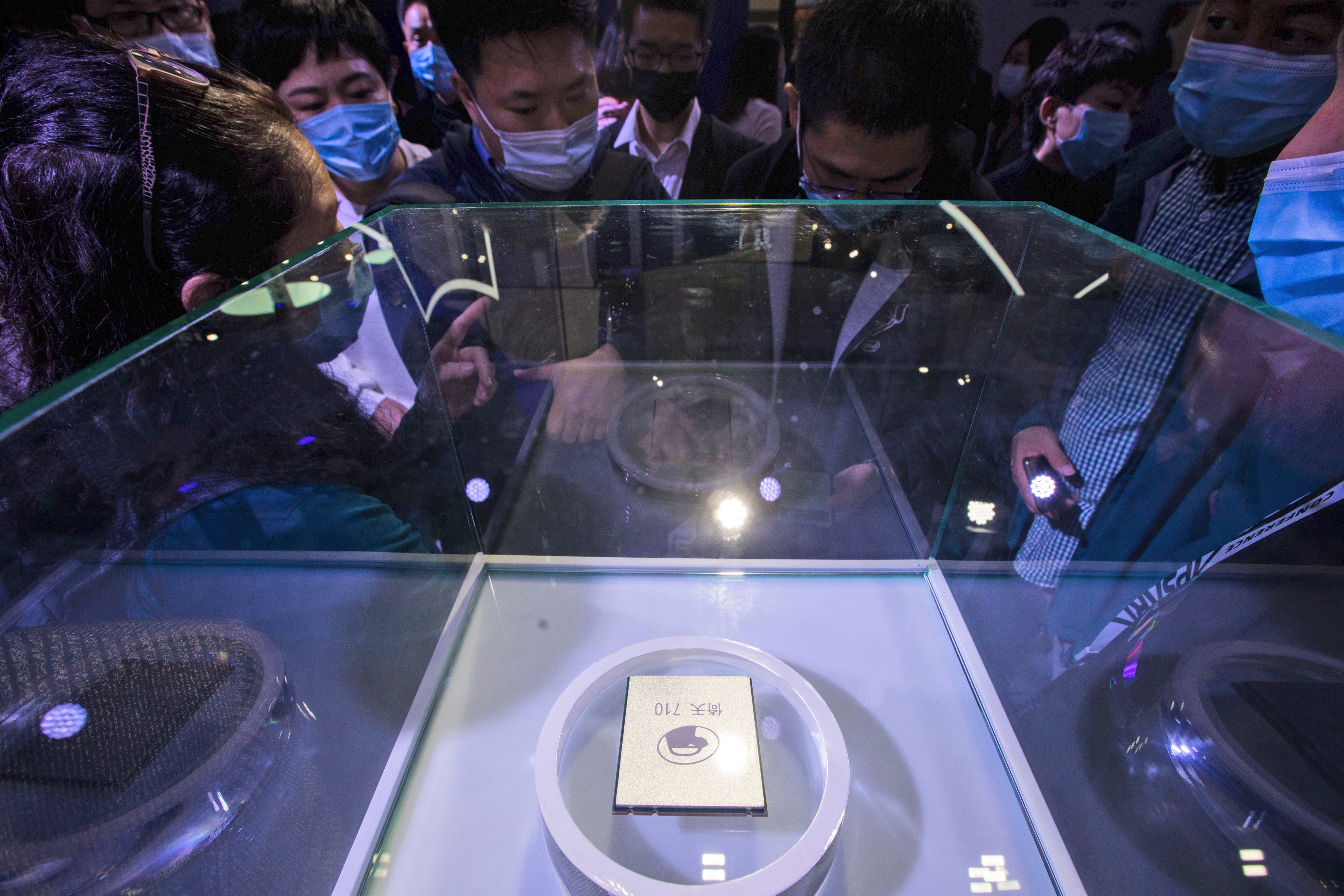 Visitors look at the Arm-based Yitian 710 server processor, developed by Alibaba’s T-Head unit, at the Apsara Conference, in Hangzhou, Zhejiang province, Oct. 19, 2021. Photo: Chinatopix via AP