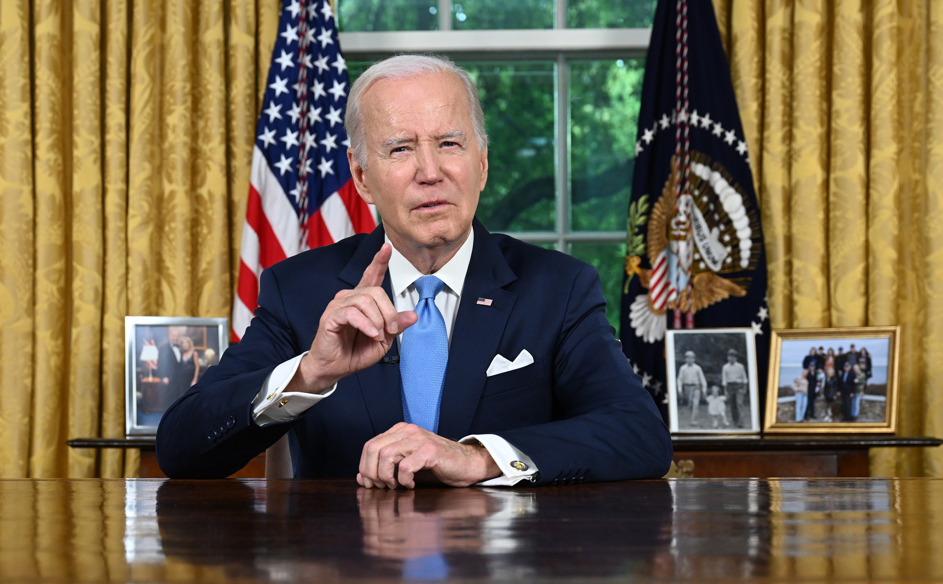 US President Joe Biden addresses the nation in the Oval Office of the White House on Friday in Washington. Photo: Pool / Getty Images / TNS