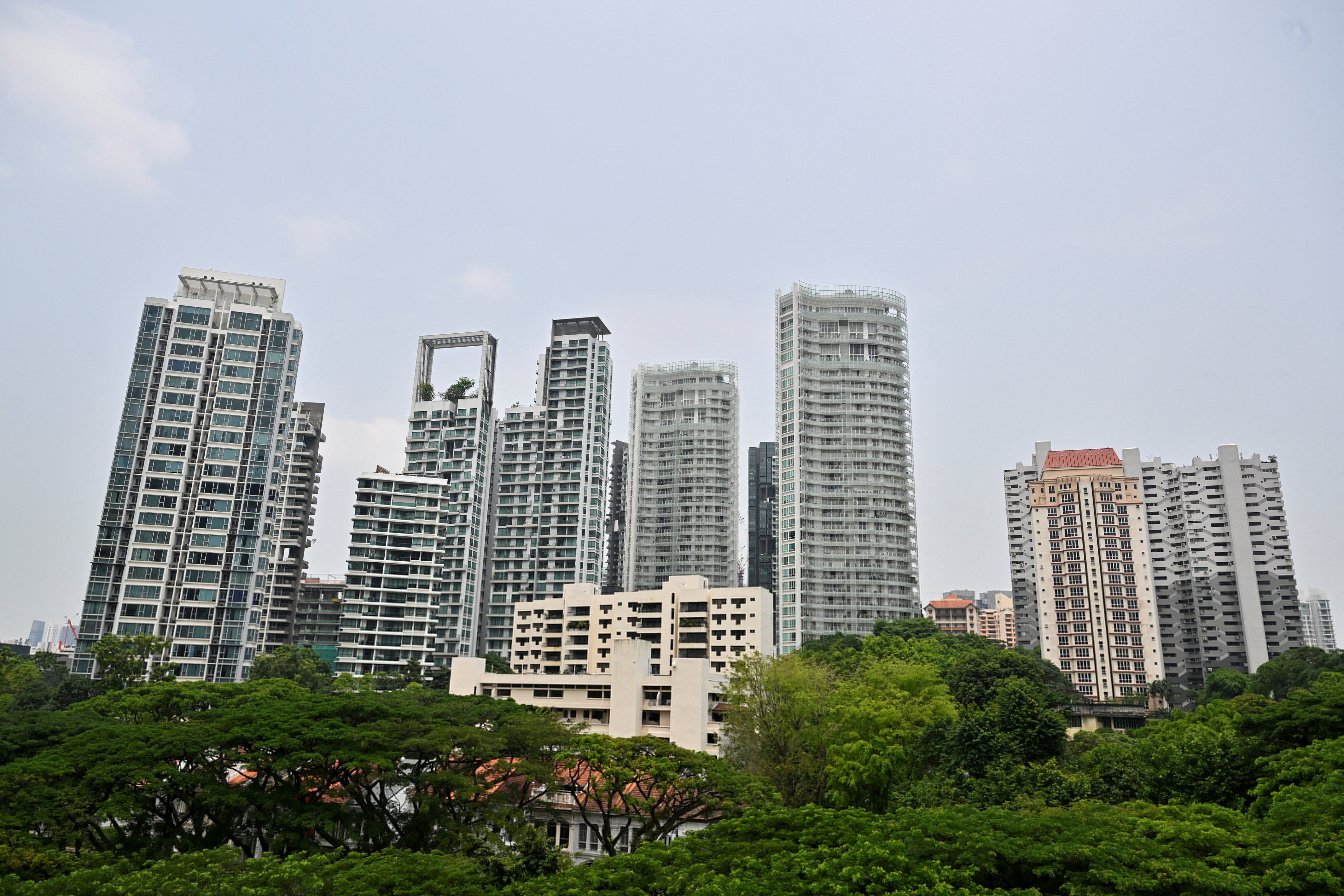 Private residential properties are seen near Orchard Road in Singapore on April 13. The government’s efforts to rein in speculative demand would be more effective if numerous tax loopholes were closed. Photo: Reuters