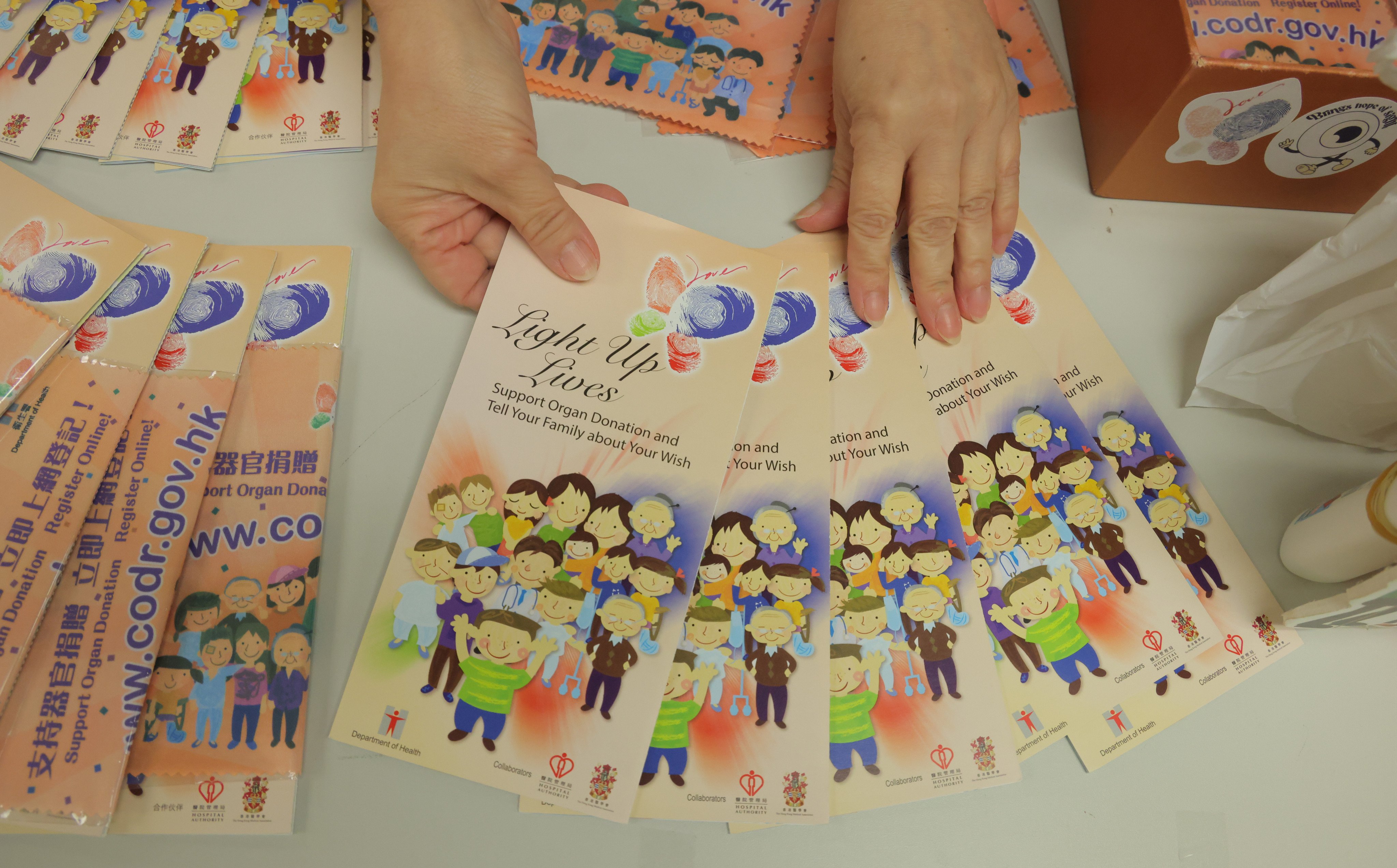 Leaflets promoting organ donation are spread out at a hospital booth in Hong Kong. Photo: Jelly Tse