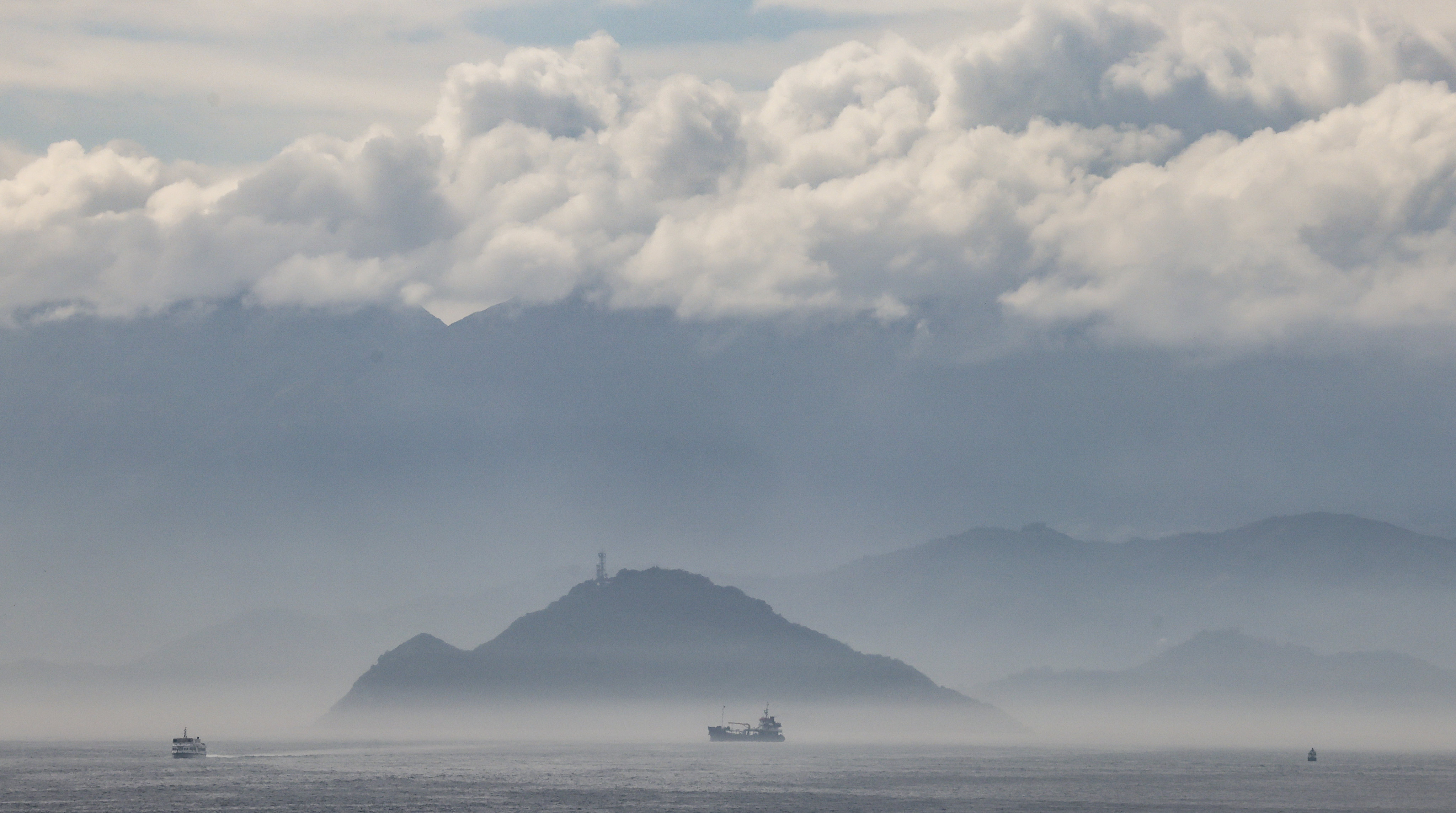 The sea facing Kau Yi Chau is shrouded in mist on February 10. Given its immense cost, complexity and risks, the government must think through the Kau Yi Chau Artificial Islands project before starting work. Photo: Jelly Tse