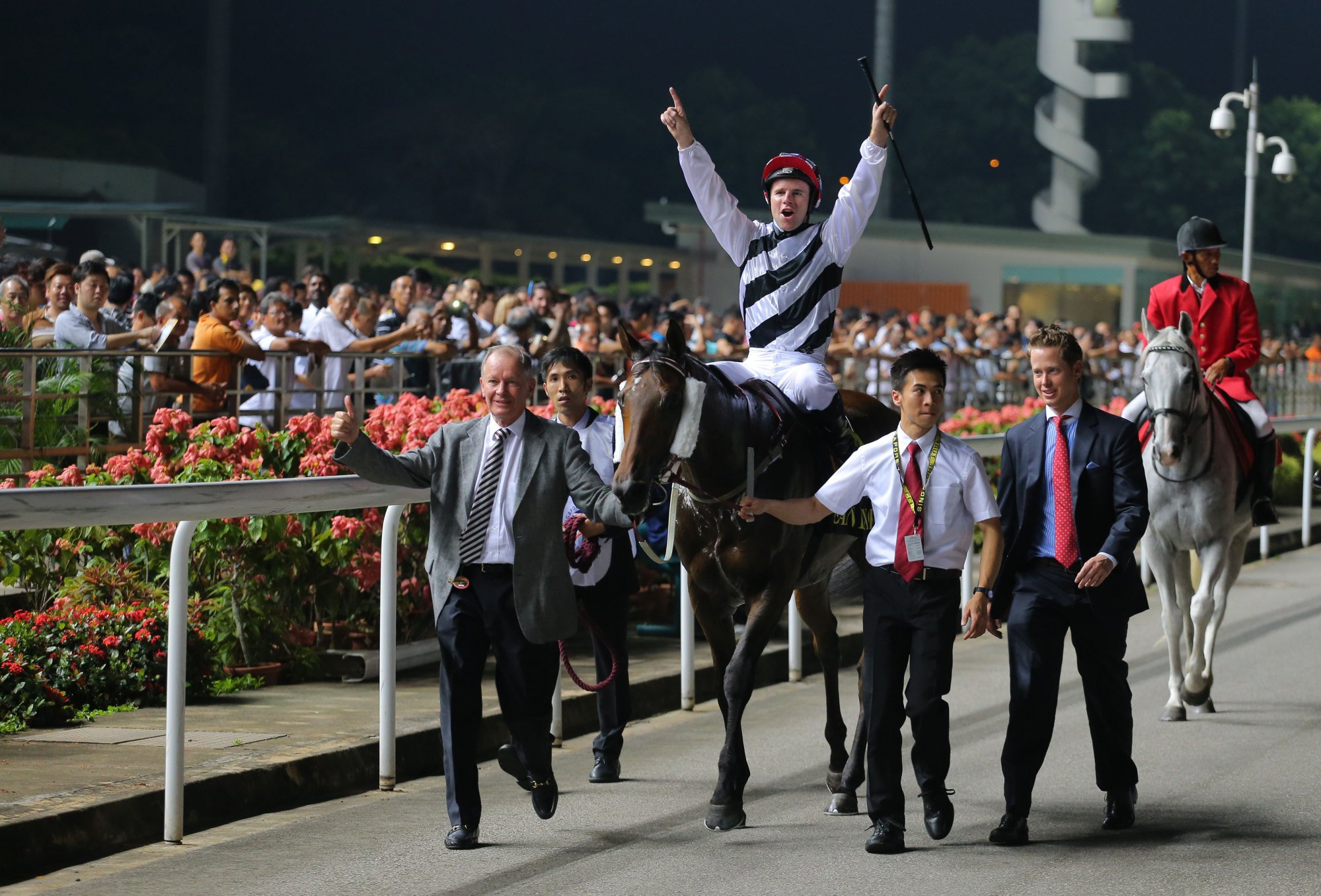 Trainer John Moore (left) and jockey Tomy Berry celebrate Dan Excel’s 2015 Singapore Airlines International Cup victory at Kranji.