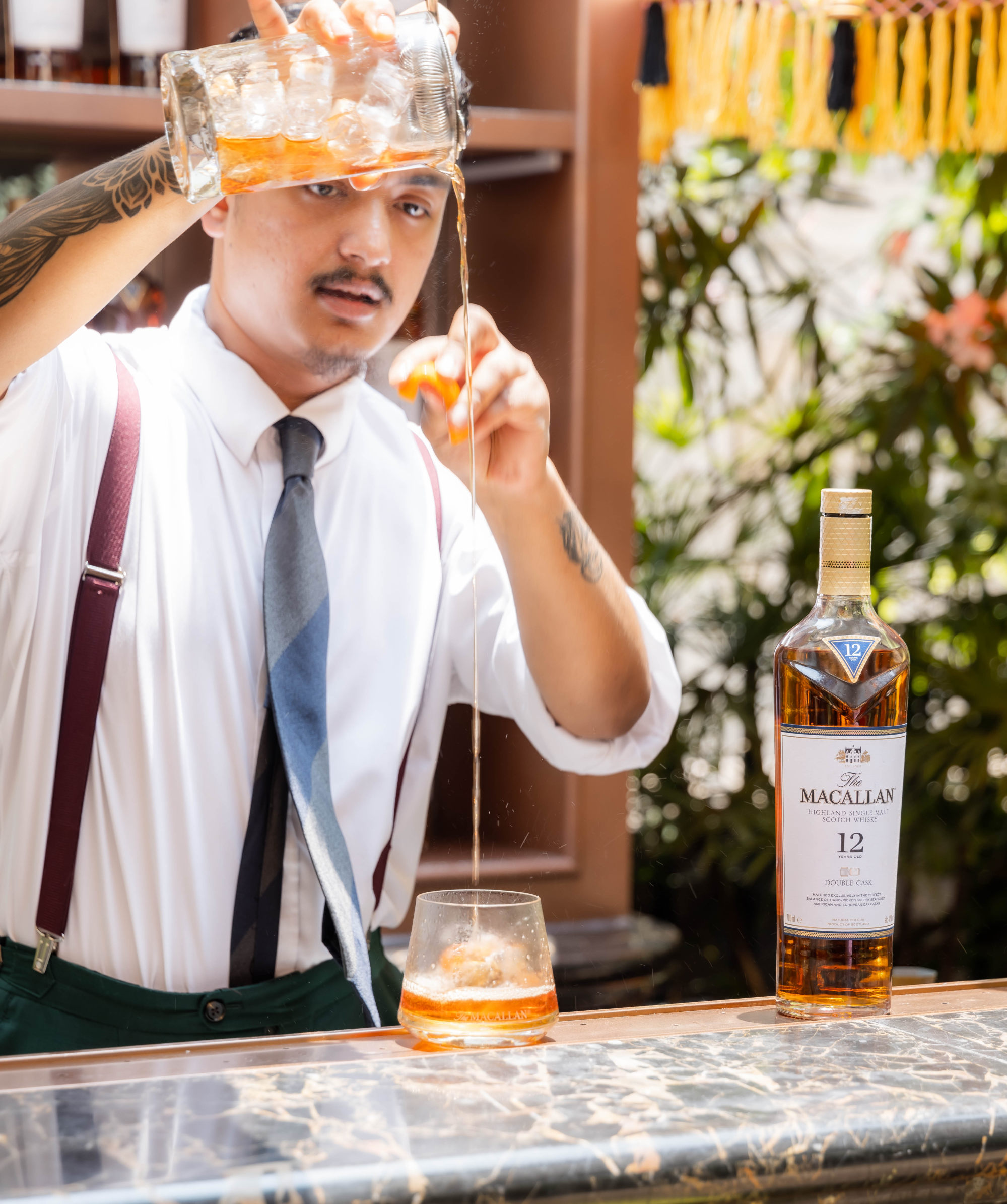 A mixologist makes a Macallan signature cocktail at a tasting event for the Double Cask Collection. Photo: The Macallan