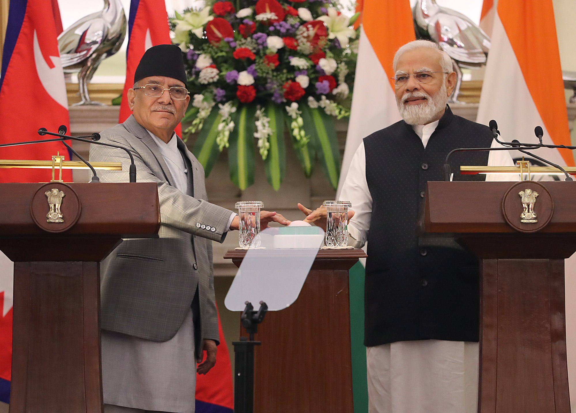 Nepal’s Prime Minister Pushpa Kamal Dahal (left) and Indian Prime Minister Narendra Modi (right) press a button to inaugurate the freight rail operation between India and Nepal during their meeting at Hyderabad House, in New Delhi on June 1, 2023. Photo: EPA-EFE