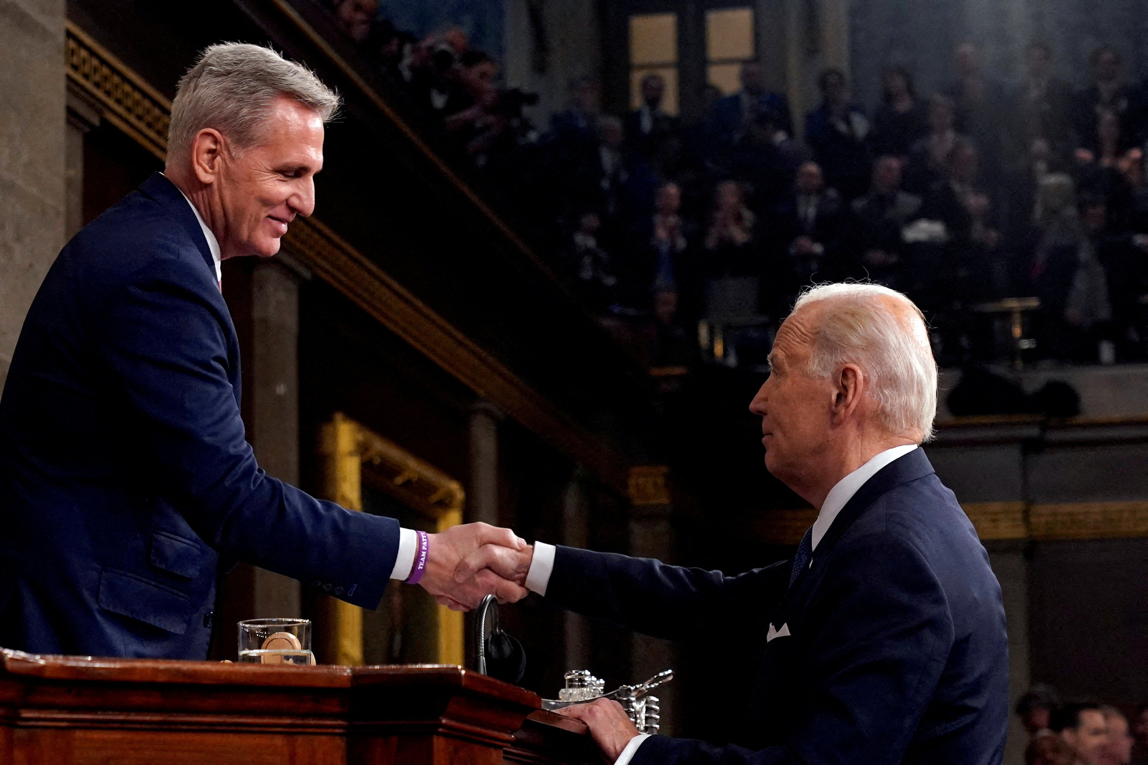 House Speaker Kevin McCarthy (left) shakes hands with US President Joe Biden after the State of the Union address to a joint session of Congress at the Capitol in Washington on February 7. Biden has praised McCarthy for his role in negotiations over the US debt ceiling despite the economic disruption and loss of global standing it brought the country. Photo: Reuters