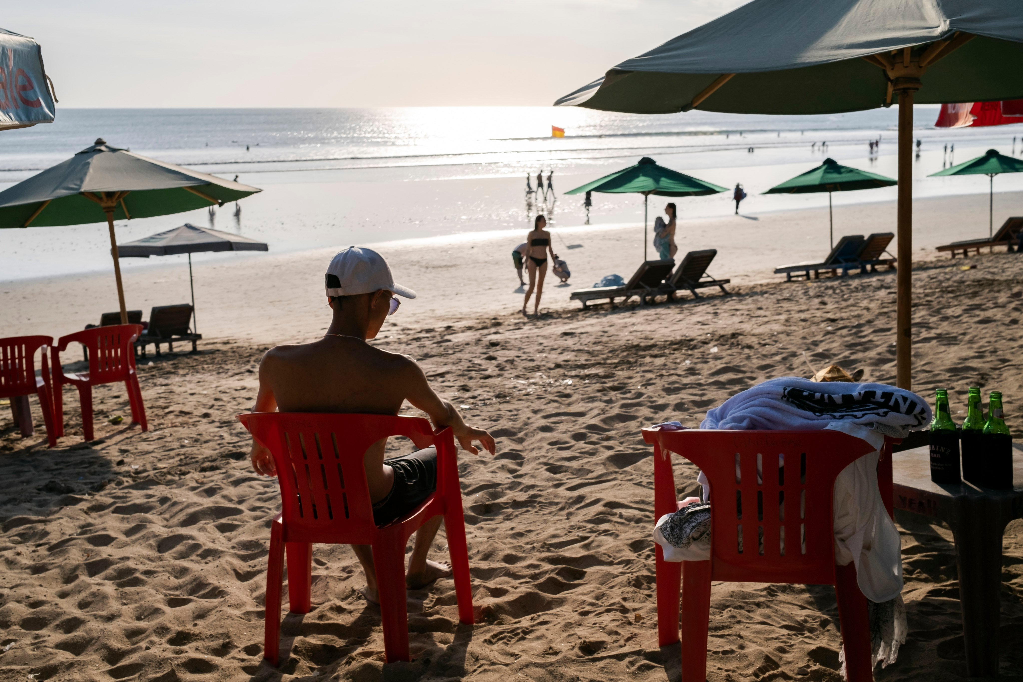 Tourists on a beach in Kuta, Bali, Indonesia, on May 22. We will need the psychological ability to construct our own strong motivations to remain active and creative, not for the purpose of surviving, but for the sake of experiencing, learning and growing. Photo: EPA-EFE